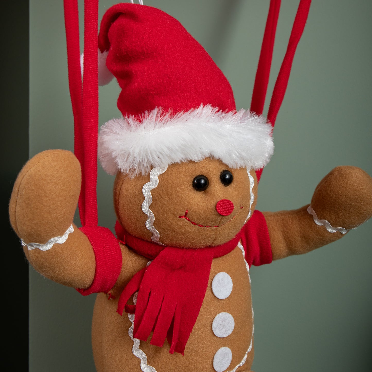 57cm Battery Operated Musical Parachuting Gingerbread Man with Leg Kicking Motion