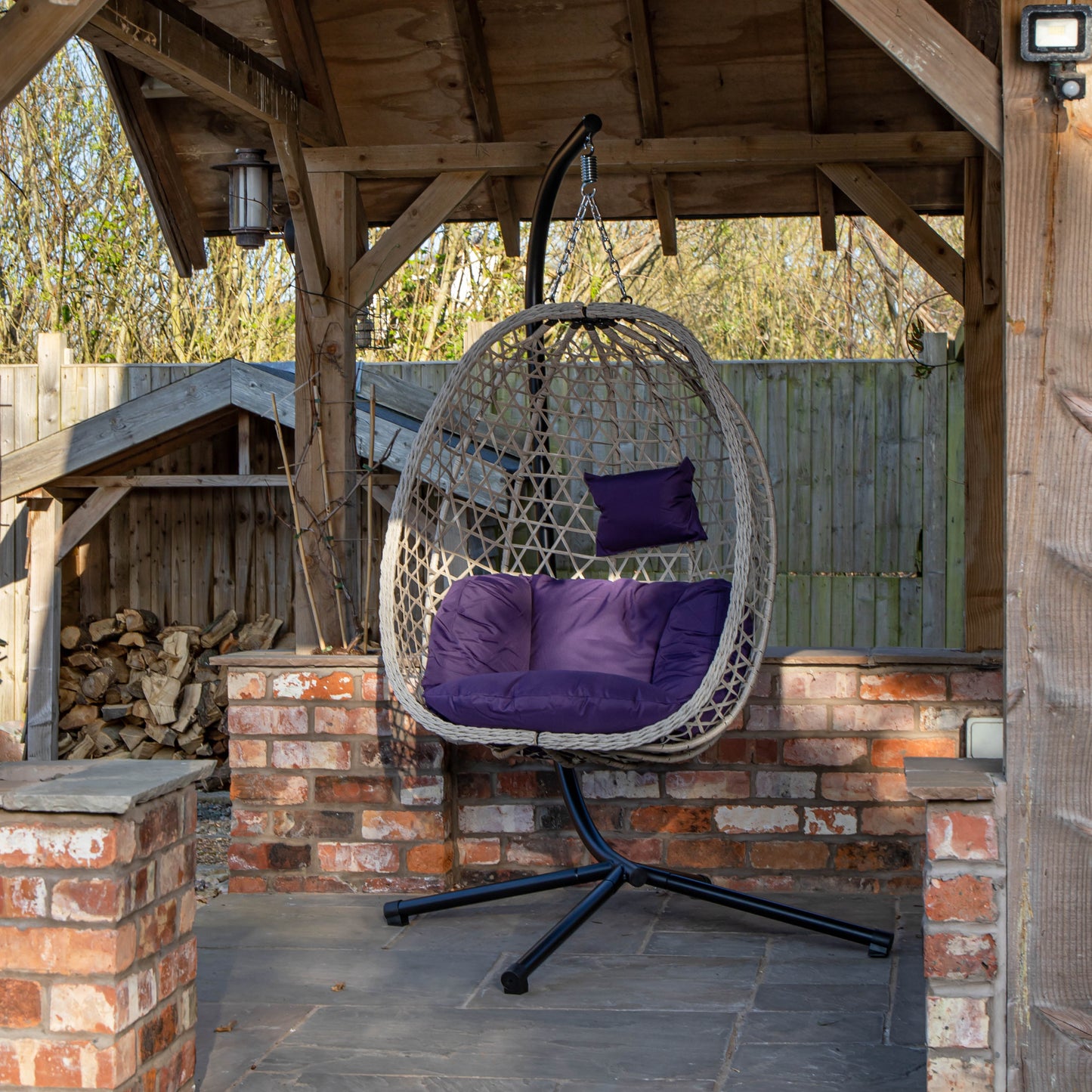 Samuel Alexander Hanging Garden Rattan Egg Chair with Steel Frame and Waterproof Cover in Indigo