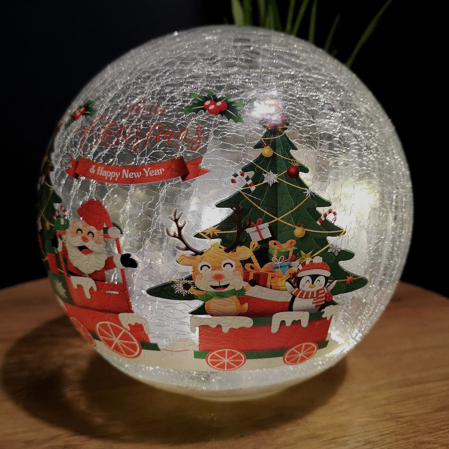 20cm Battery Operated Twinkling Warm White LED Crackle Effect Ball Christmas Decoration with Santa and Friends in Train