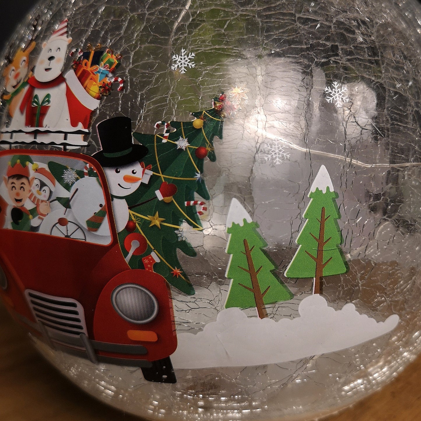 20cm Battery Operated Twinkling Warm White LED Crackle Effect Ball Decoration with Santa and Friends in Car