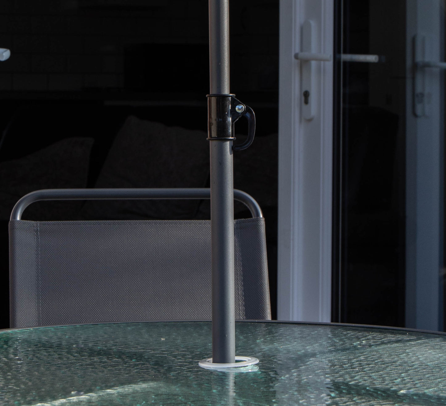 Samuel Alexander Outdoor 4 Seater Round Glass Top Table and Chairs Patio Set with Parasol in Black