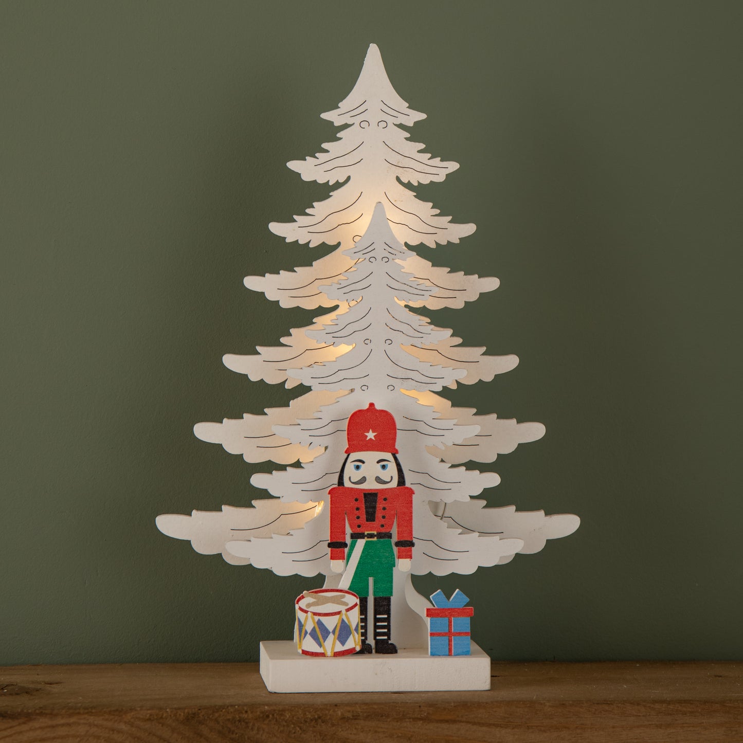 25cm LED Battery Operated Nutcracker with White Wooden Christmas Tree Scene