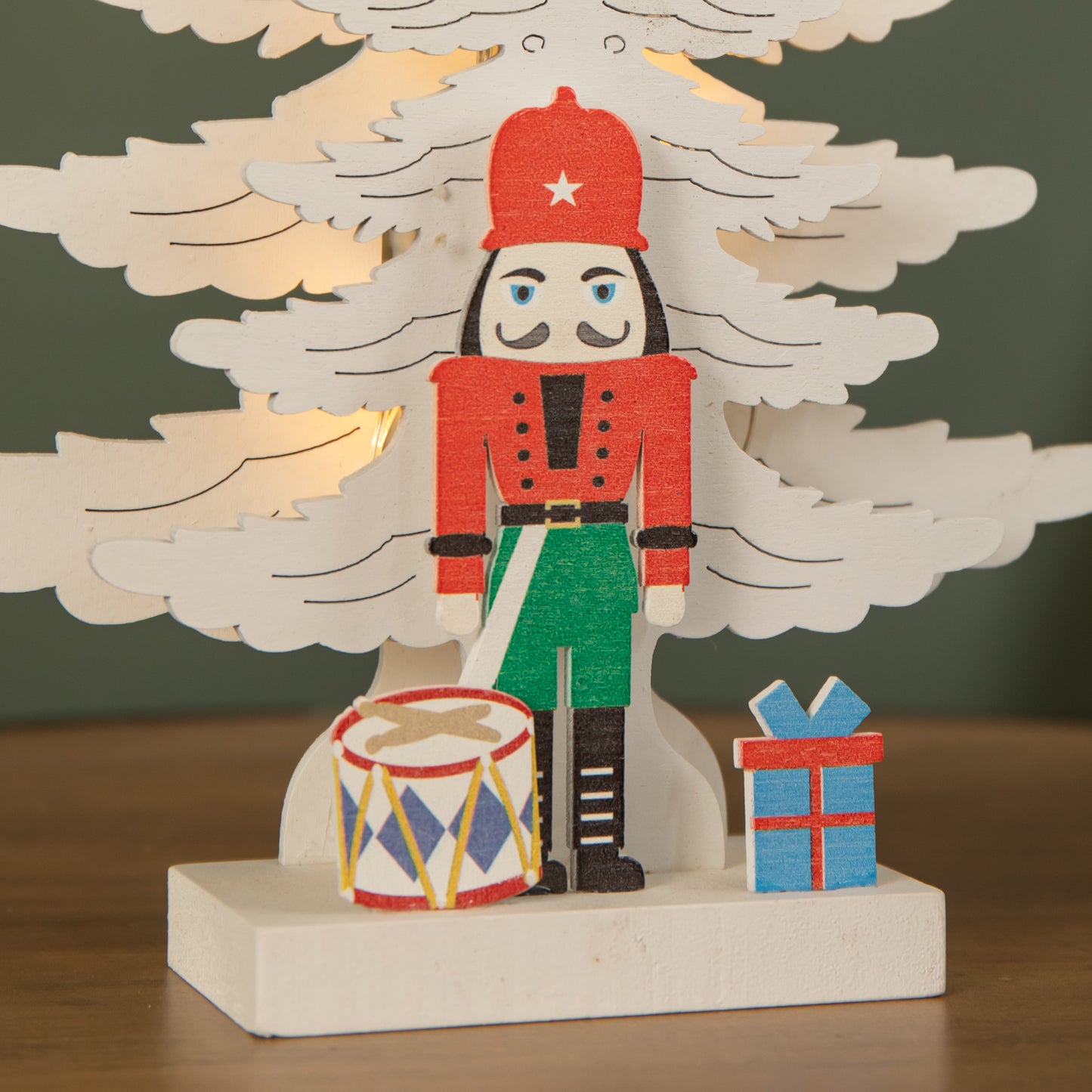 25cm LED Battery Operated Nutcracker with White Wooden Christmas Tree Scene