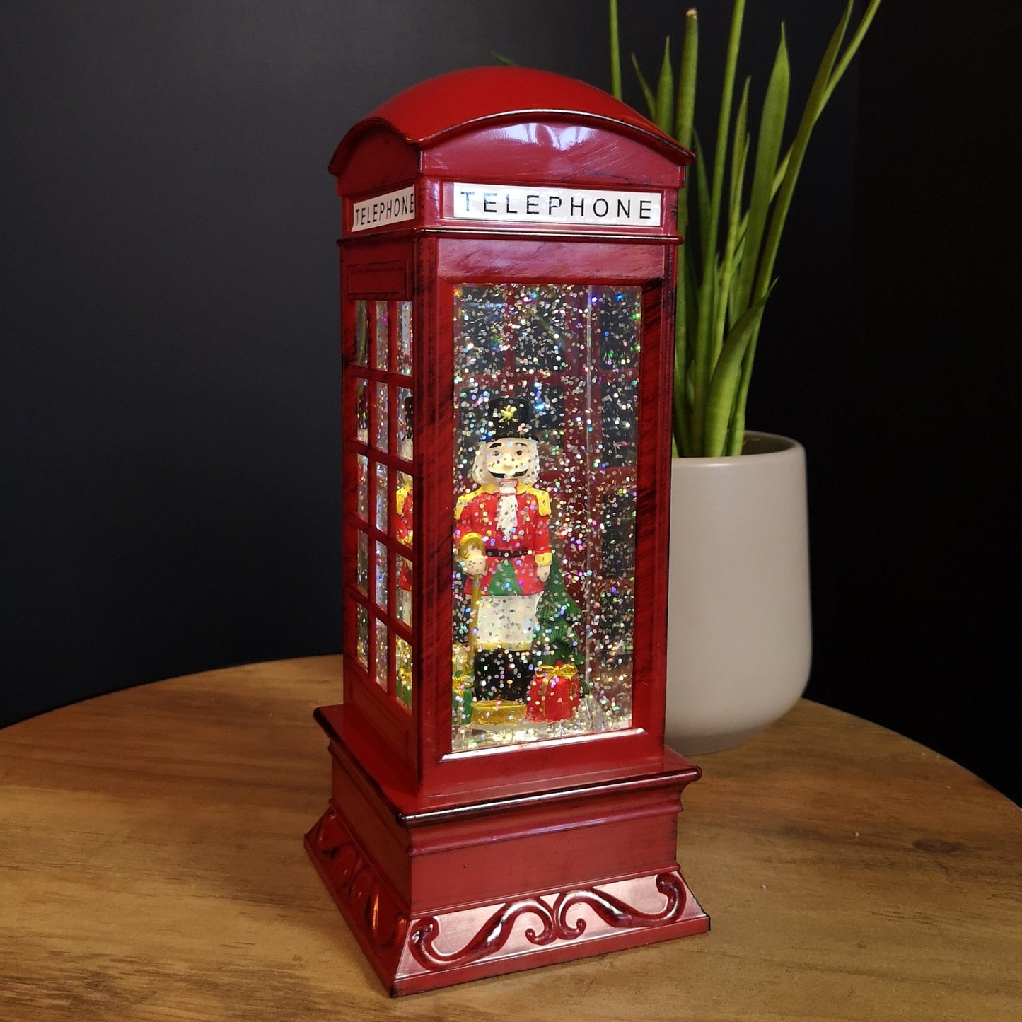 27cm LED Christmas Glitter Water Spinner Red Telephone Box with Nutcracker Scene