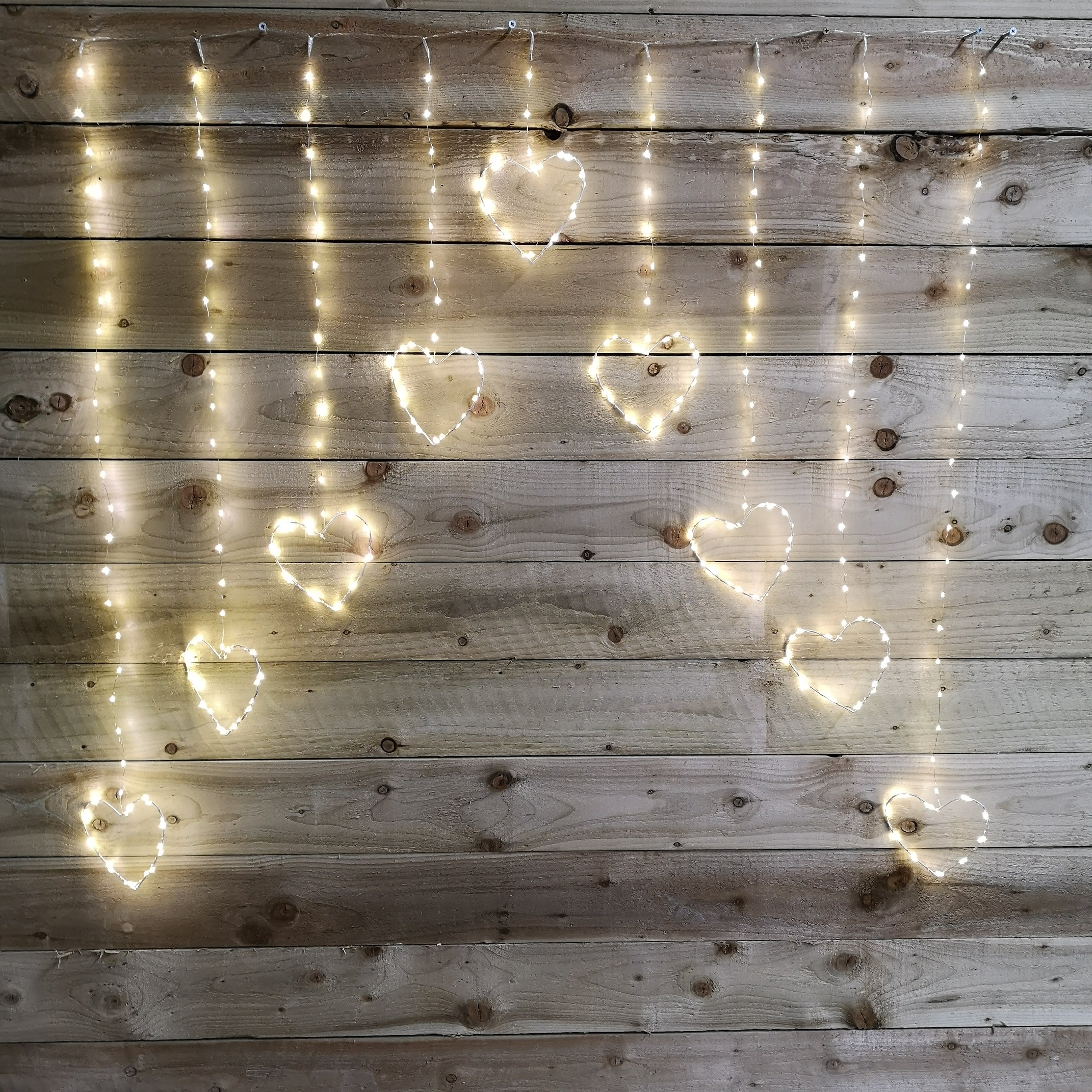 1.2m Premier Christmas Static Heart LED Silver Pin Wire V Curtain Lights in Warm White