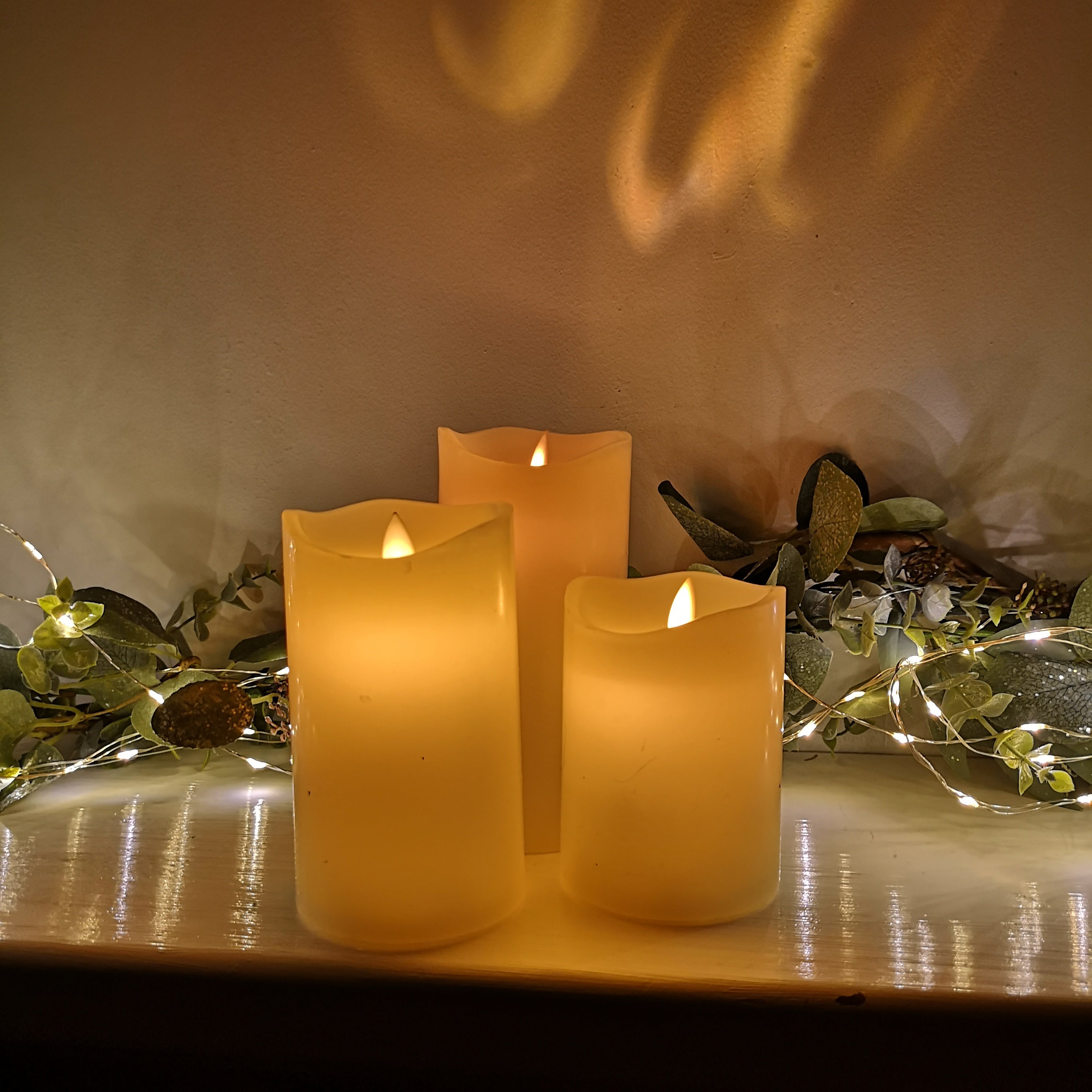 Premier Set of 3 Battery Operated Dancing Flame Candles in Cream