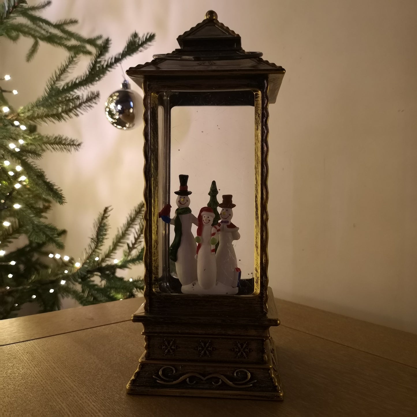 27cm Premier Glitter Water Spinner LED Lantern Christmas Decoration with Snowman Scene