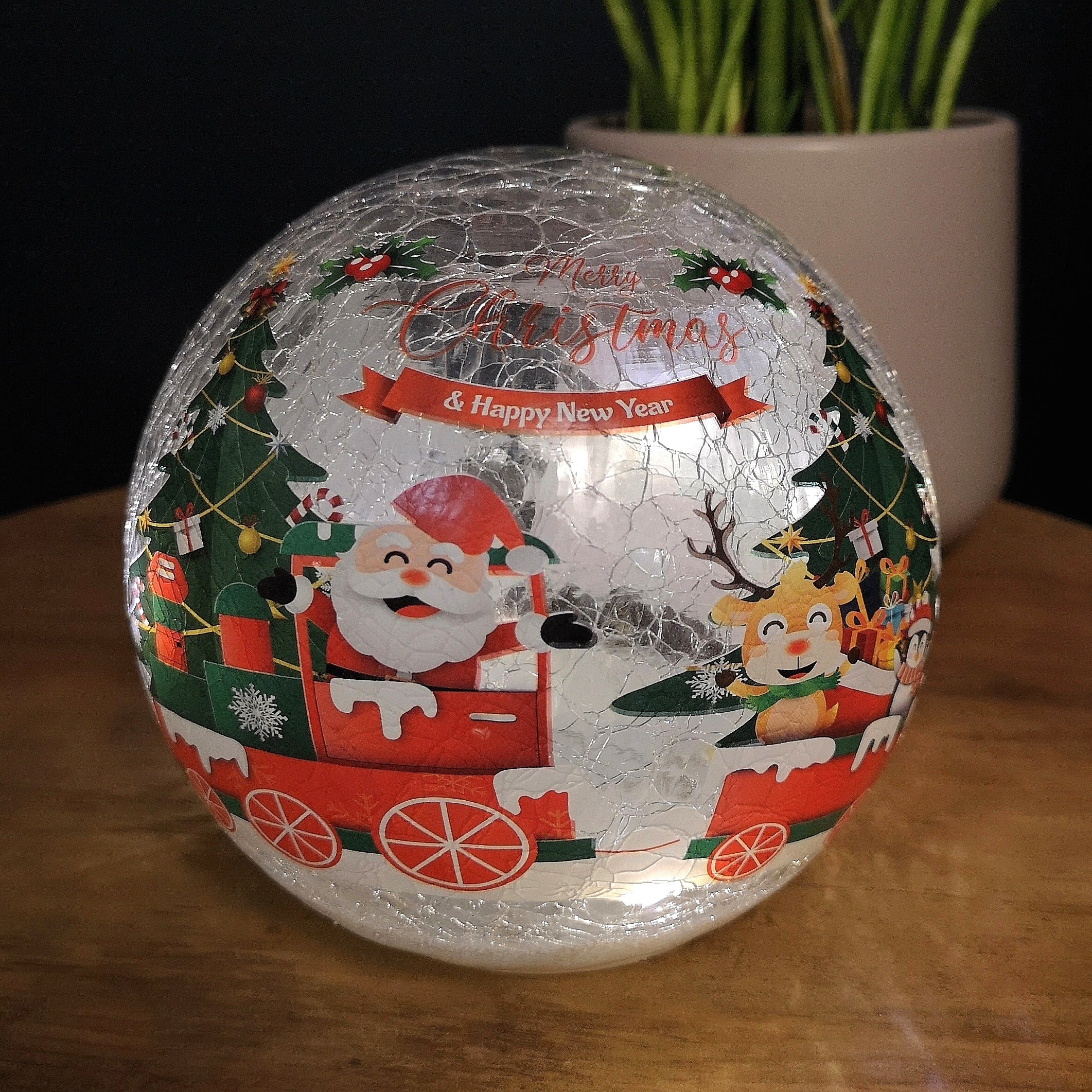 15cm Battery Operated Twinkling Warm White LED Crackle Effect Ball Christmas Decoration with Santa and Friends in Train