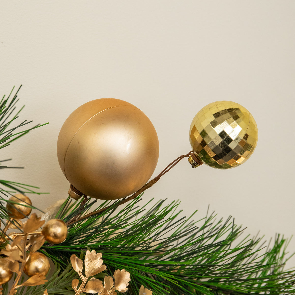 1.8m Champagne Magnolia Decorated Christmas Garland with Gold Baubles