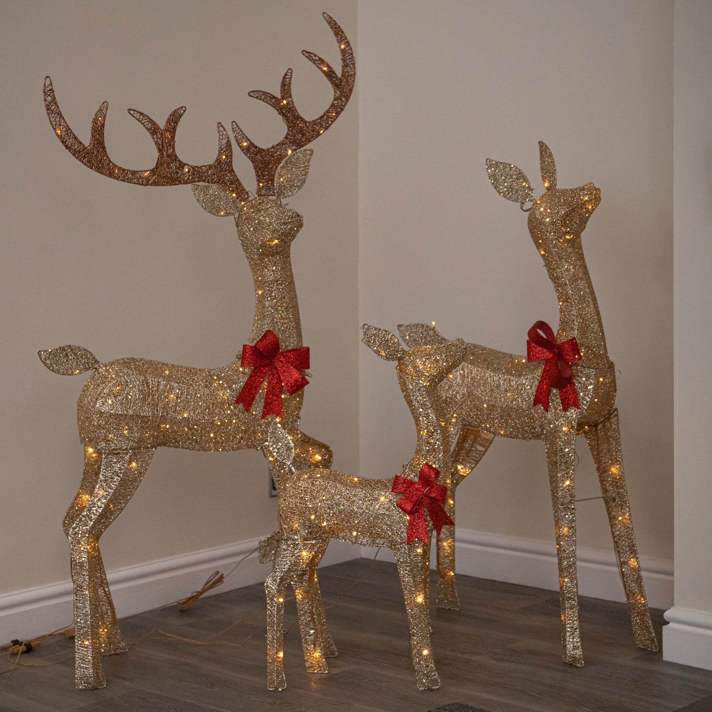 Set of 3 Gold Glitter Light Up Reindeer Family with 210 Warm White LEDs & Timer