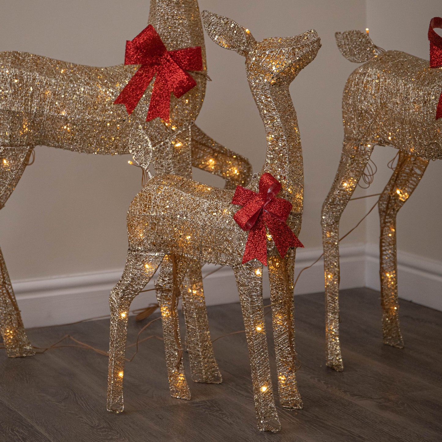 Set of 3 Gold Glitter Light Up Reindeer Family with 210 Warm White LEDs & Timer