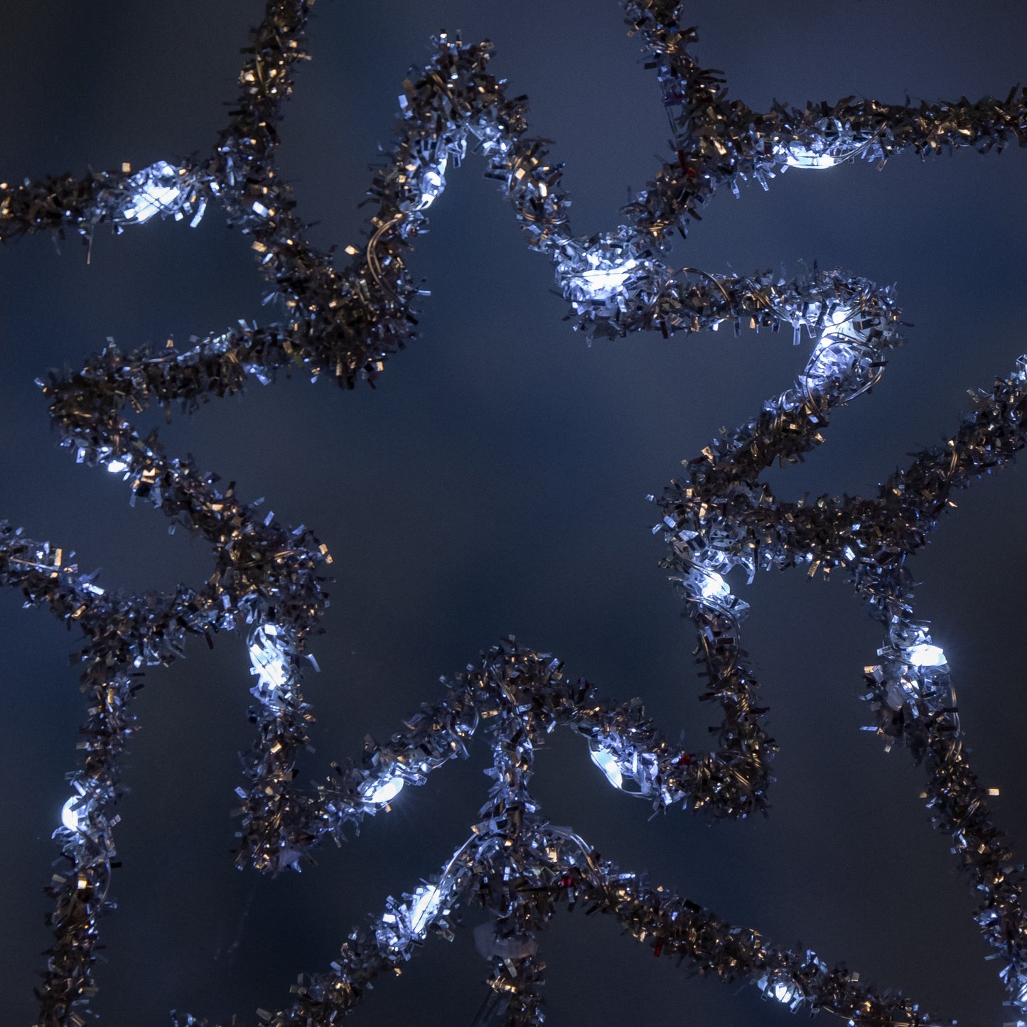 28cm Battery Powered Silver Christmas Star Tree Topper with White Multi-Action LEDs