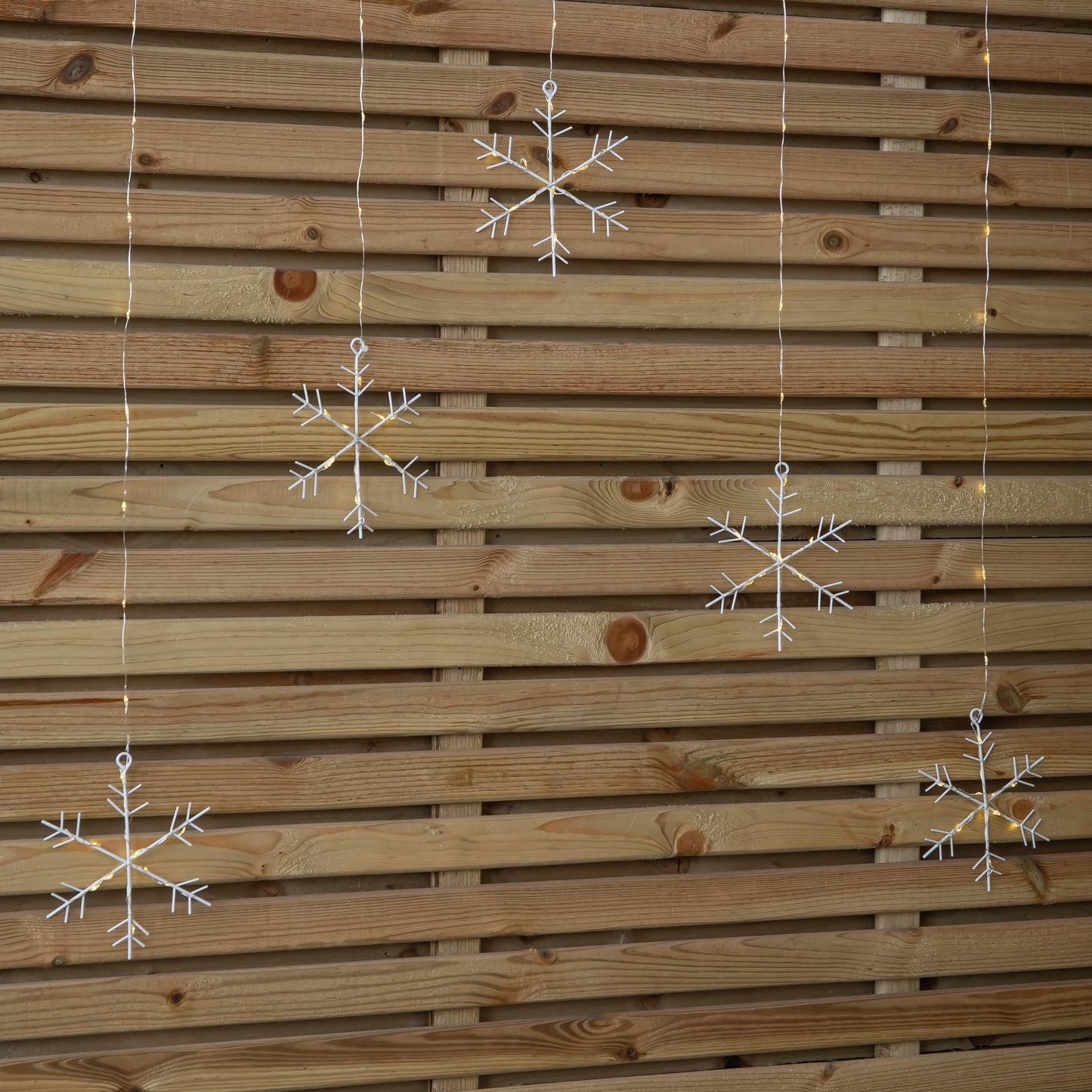 1.2m Battery Operated Snowflake Christmas Curtain Lights with 147 Warm White LEDs