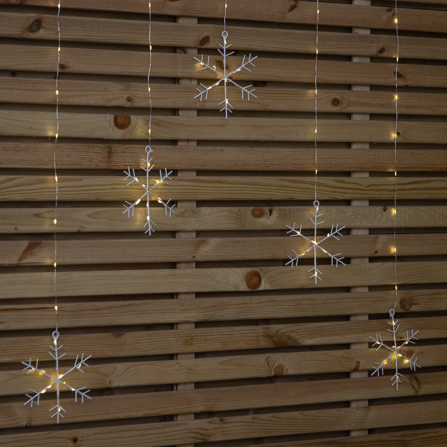 1.2m Battery Operated Snowflake Christmas Curtain Lights with 147 Warm White LEDs