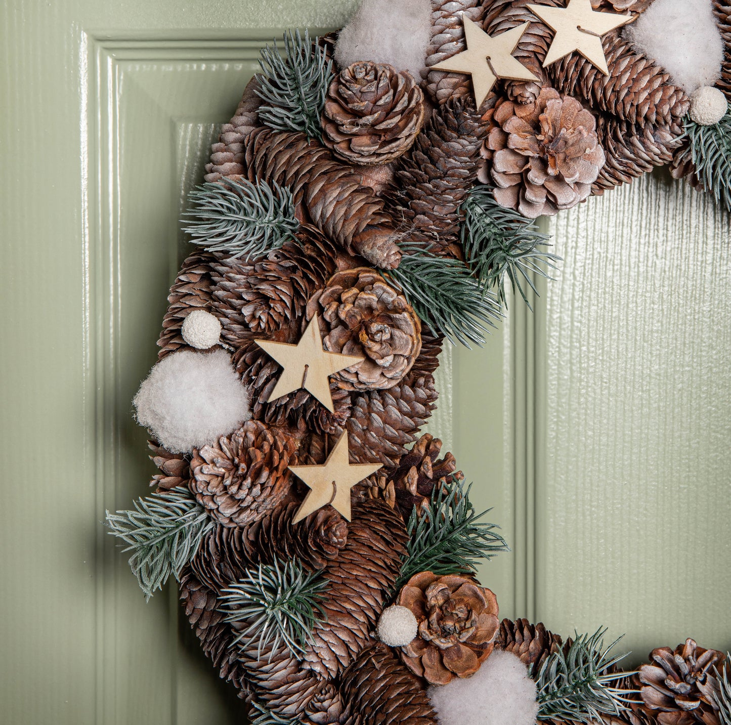 50cm Frosted Hanging Christmas Wreath with Pine Cones & Wooden Stars