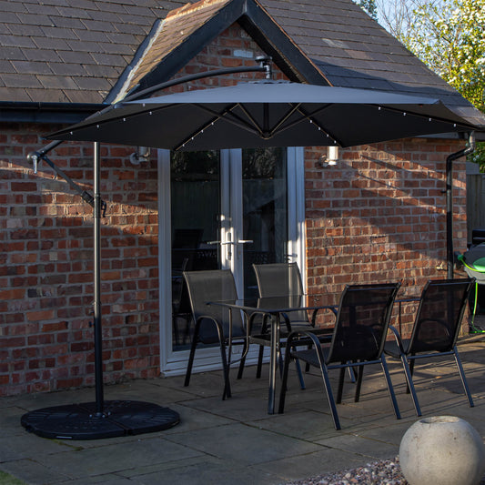 Outdoor 4 Person Rectangular Glass Top Garden Dining Table Chairs With Blue Banana Lit Parasol and Base