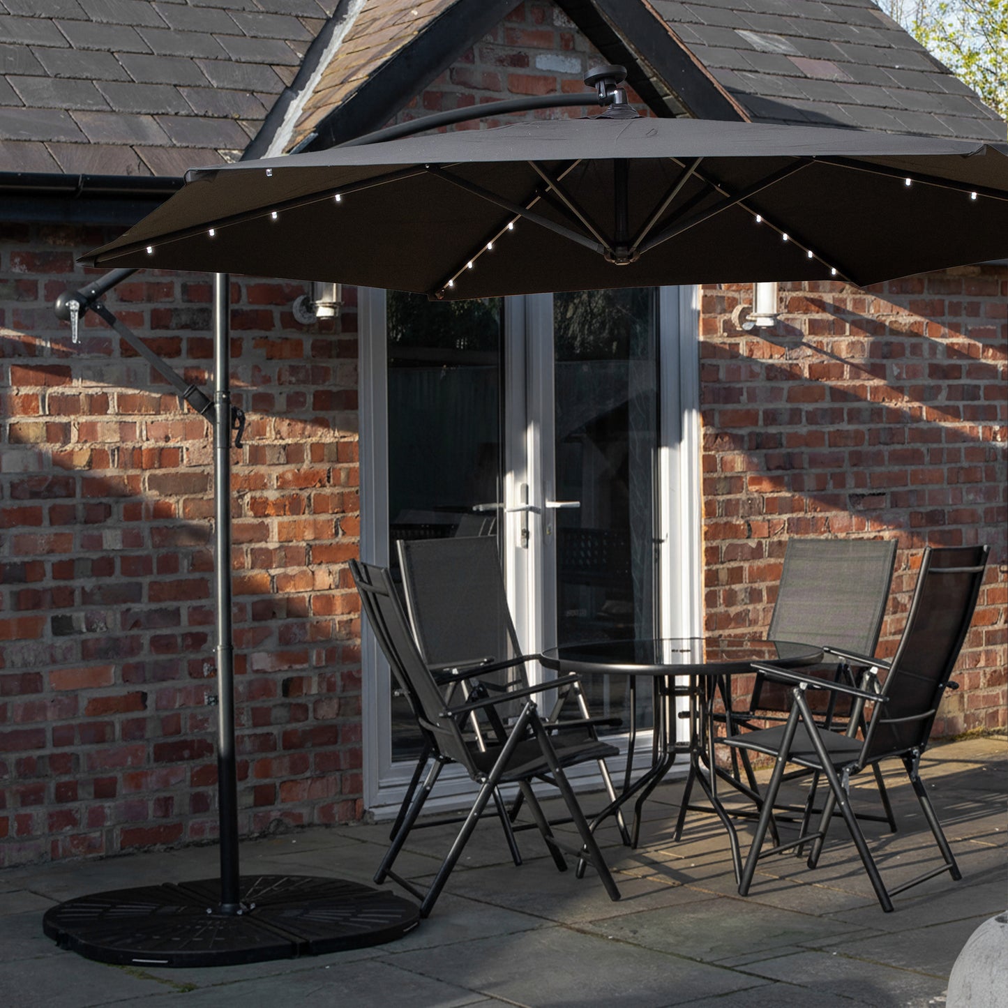 Outdoor 4 Person Round Glass Top Garden Dining Table Chairs With Black Banana Lit Parasol and Base Set
