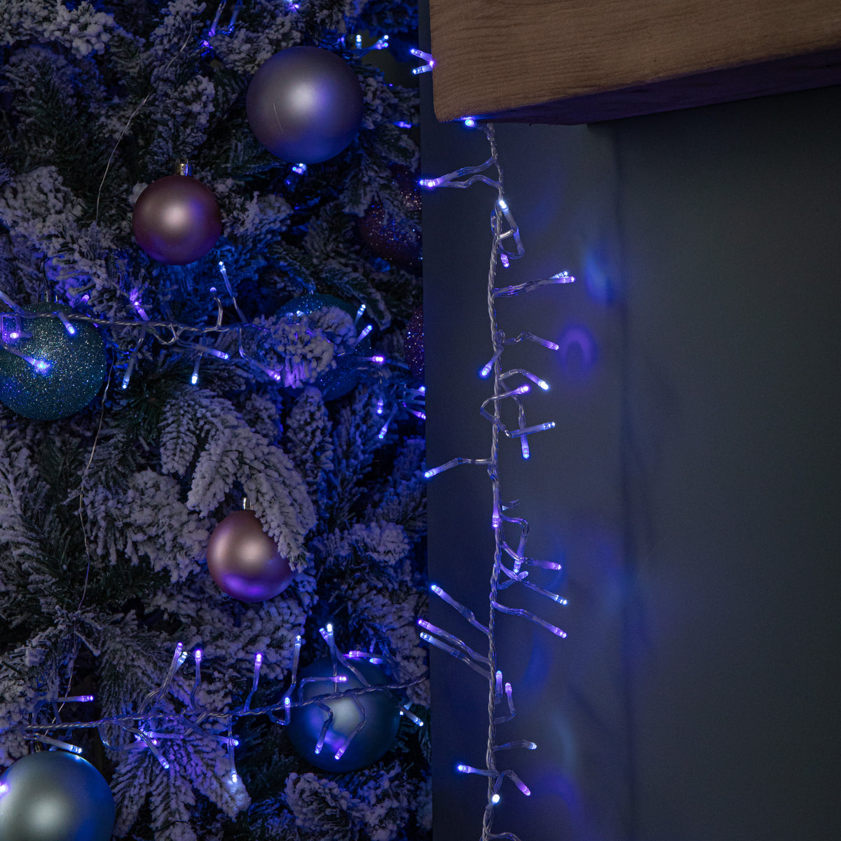 12.4m 960 LED Christmas Cluster Multi-Action String Lights with Timer in Blue, Purple & White on Clear Cable