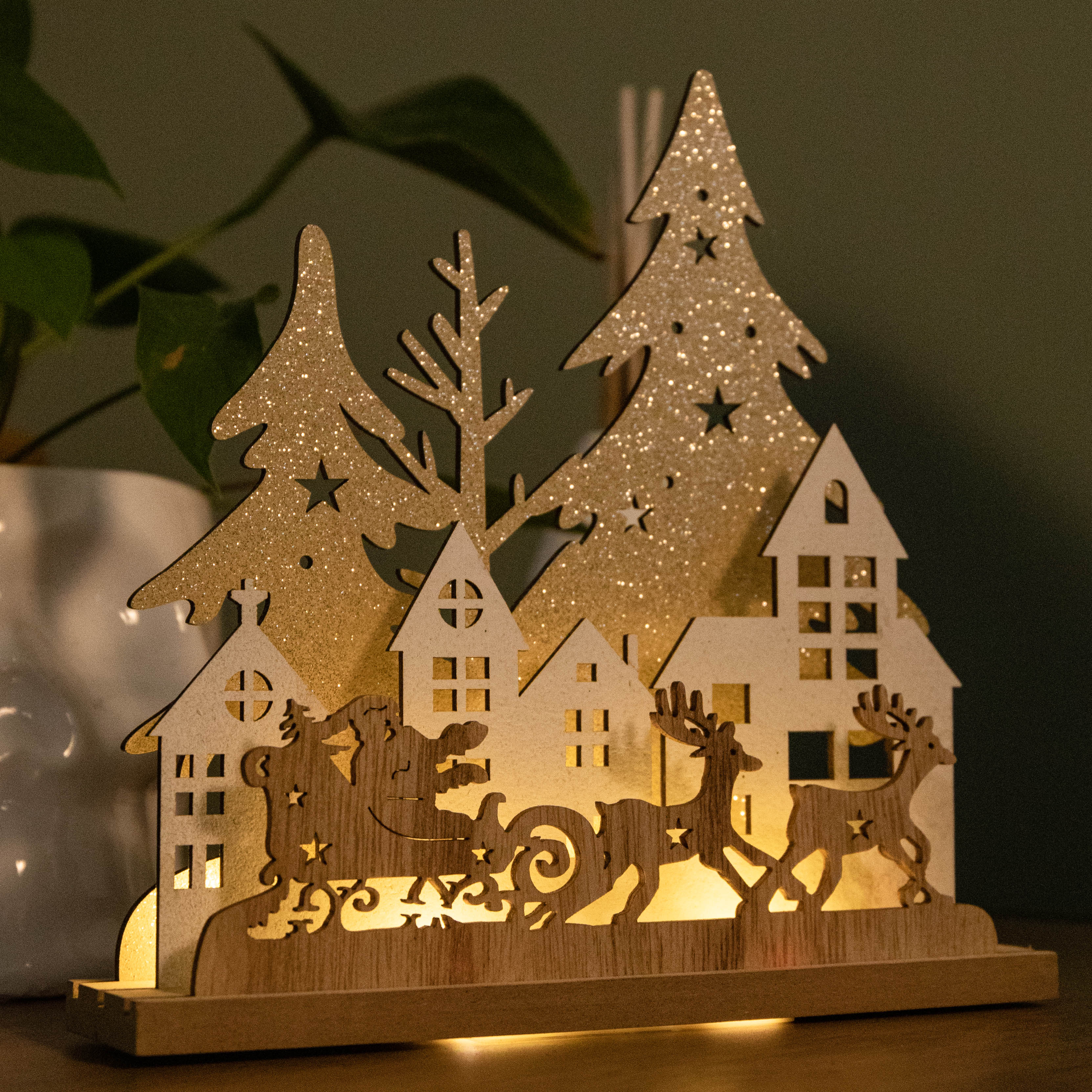 20cm Battery Operated Light up Wooden Village with Santa in Sleigh and Warm White LEDs
