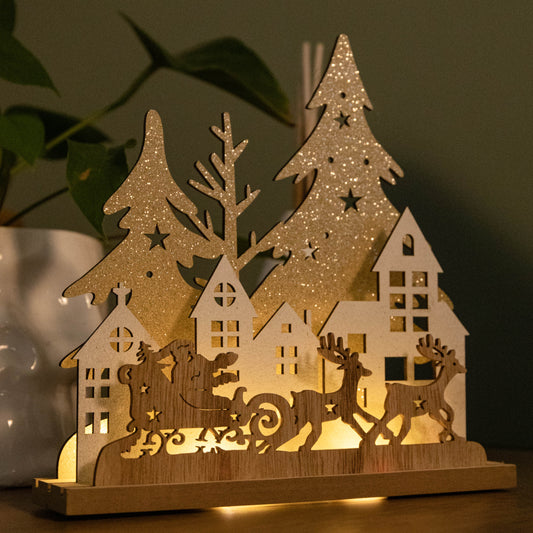 20cm Battery Operated Light up Wooden Village with Santa in Sleigh and Warm White LEDs