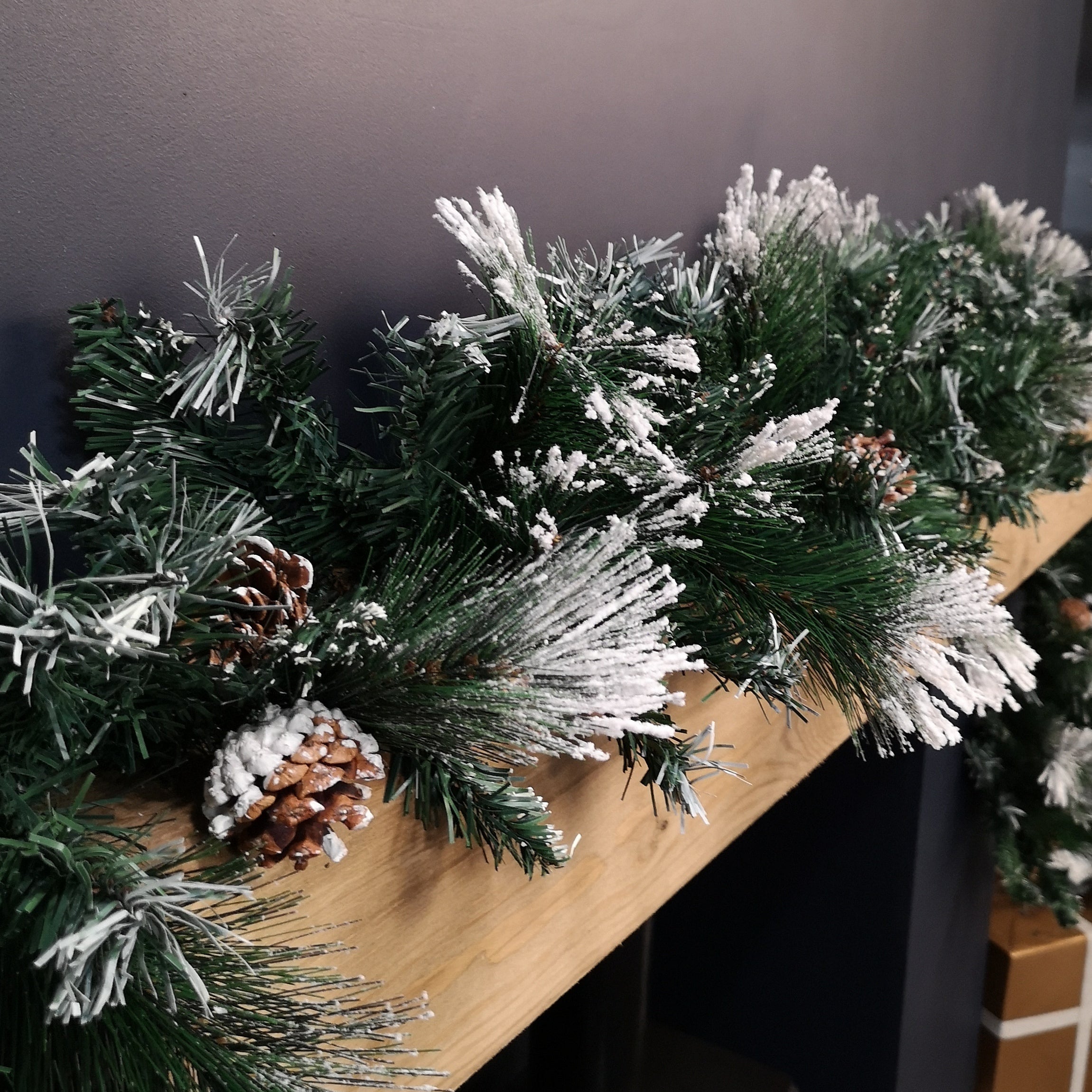 2.7m Snow Flocked Christmas Garland with Pine Cones and Mixed Needles