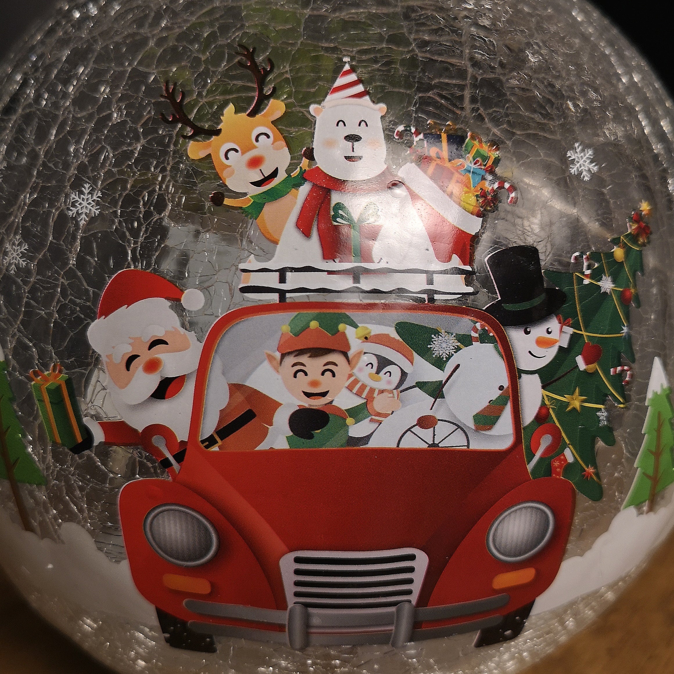 20cm Battery Operated Twinkling Warm White LED Crackle Effect Ball Decoration with Santa and Friends in Car