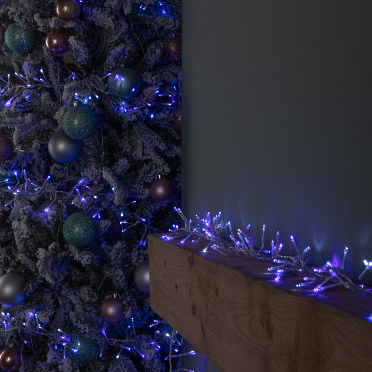 12.4m 960 LED Christmas Cluster Multi-Action String Lights with Timer in Blue, Purple & White on Clear Cable