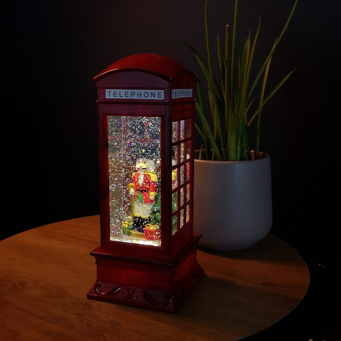 27cm LED Christmas Glitter Water Spinner Red Telephone Box with Nutcracker Scene