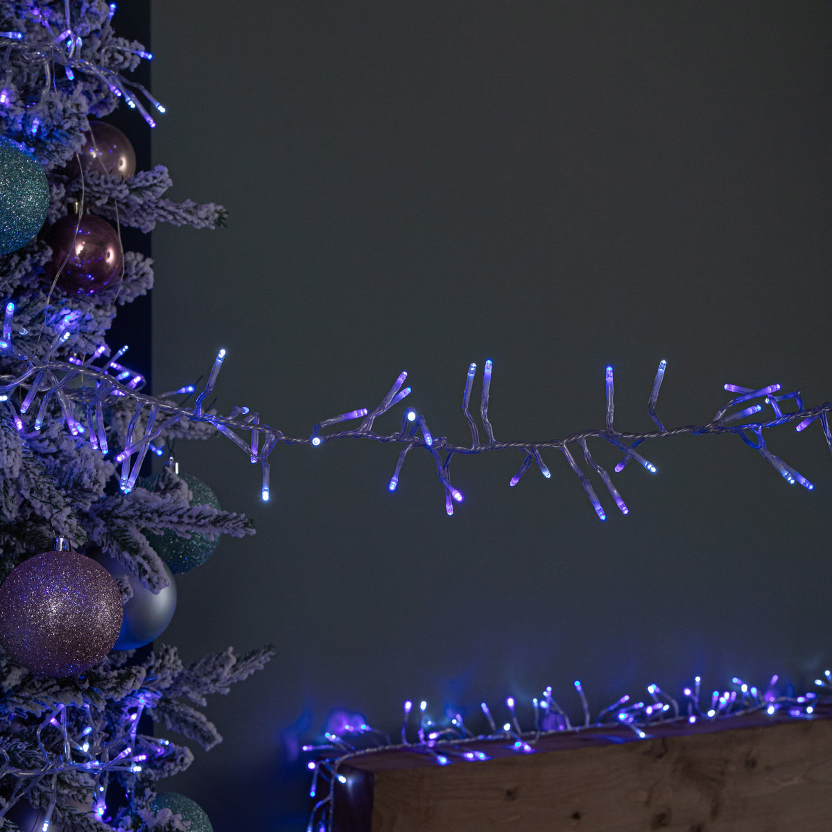 12.4m 960 LED Christmas Cluster Multi-Action String Lights with Timer in Blue, Purple & White on Clear Cable