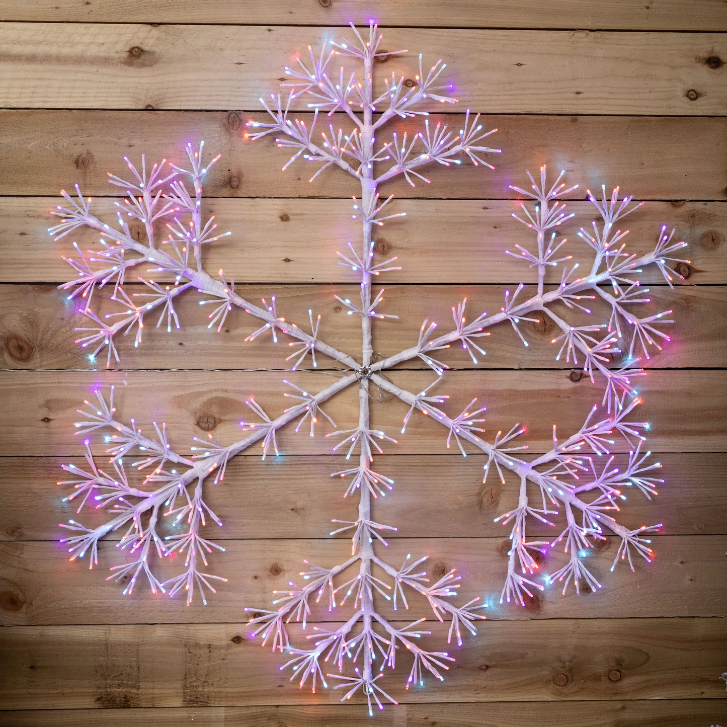 1.2m Twinkling Starburst Snowflake Christmas decoration with 960 Rainbow LEDs