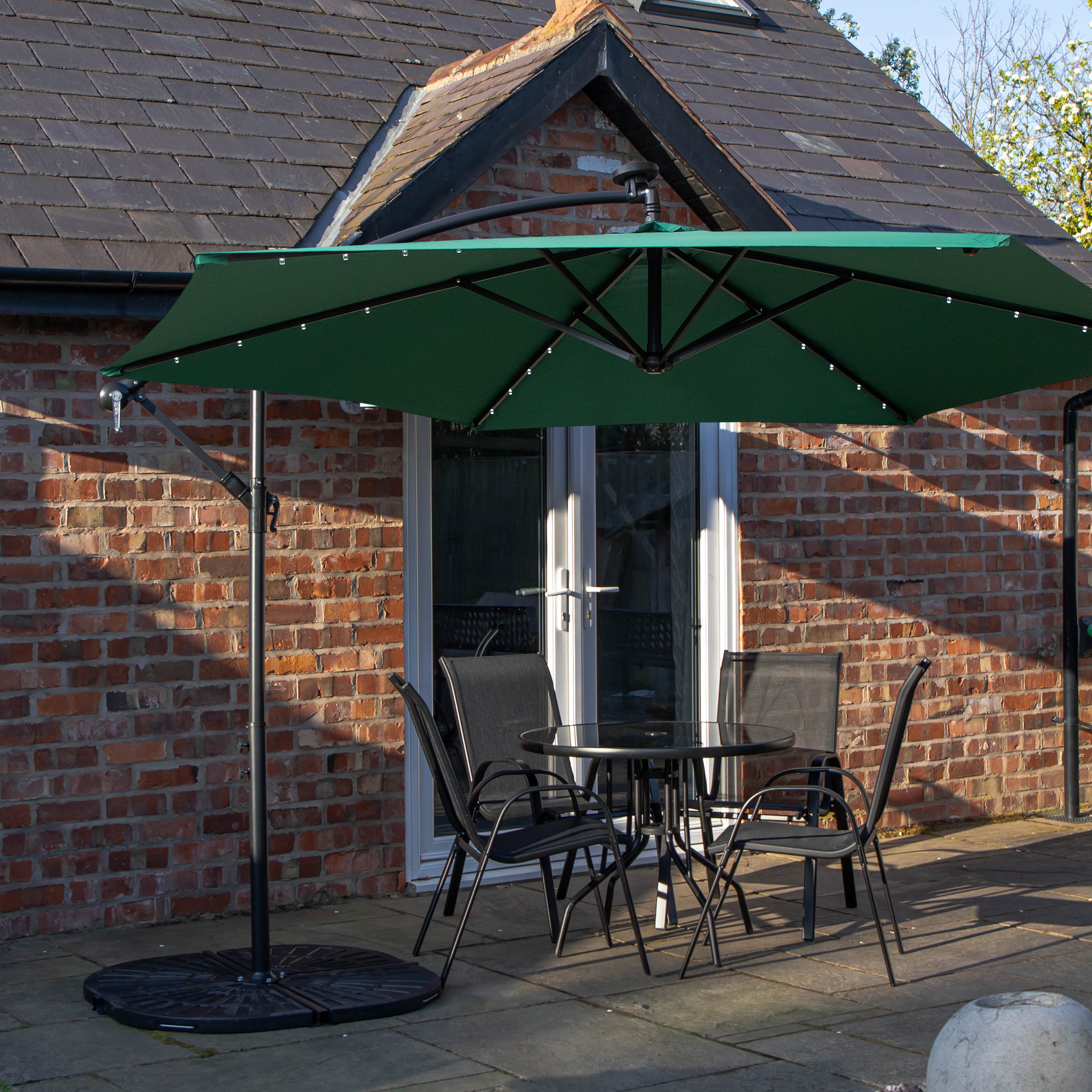 Outdoor 4 Person Round Glass Top Garden Dining Table Chairs With Green Banana Lit Parasol and Base