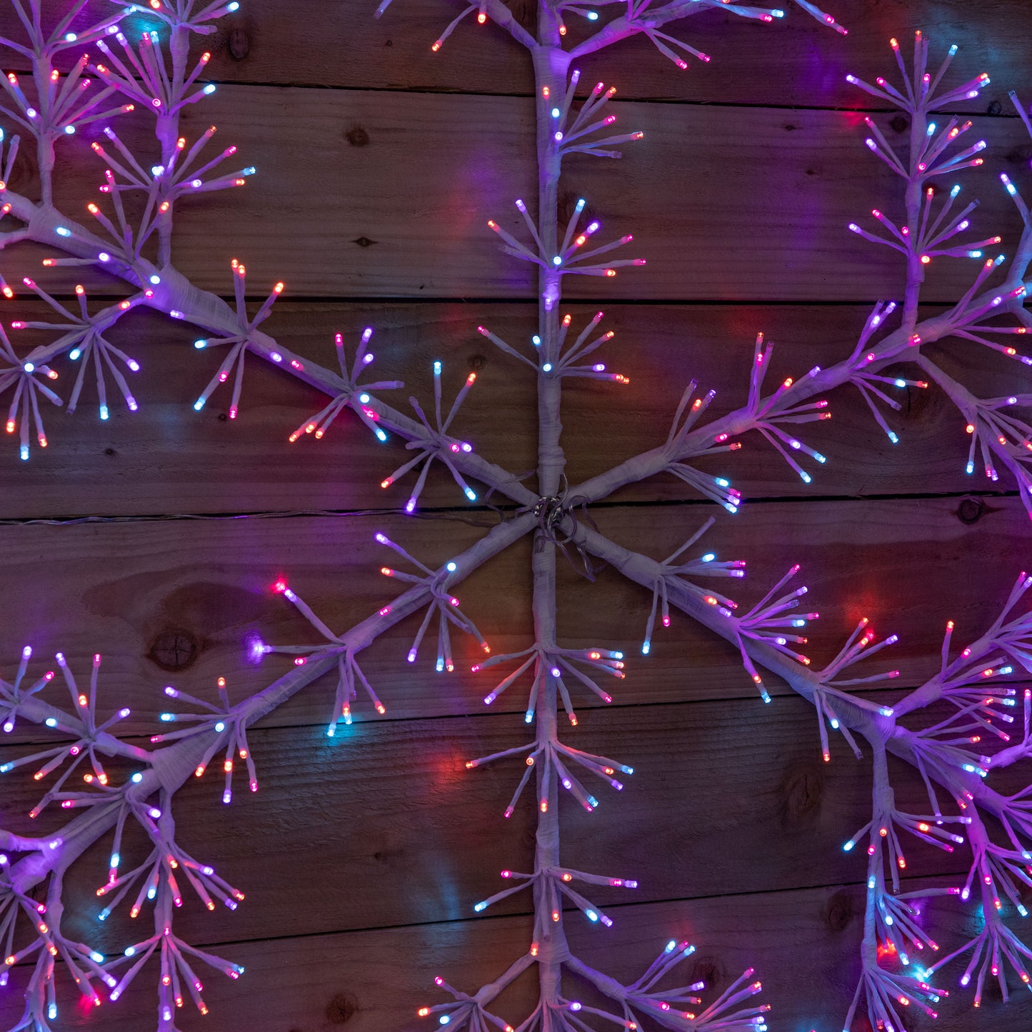 1.2m Twinkling Starburst Snowflake Christmas decoration with 960 Rainbow LEDs