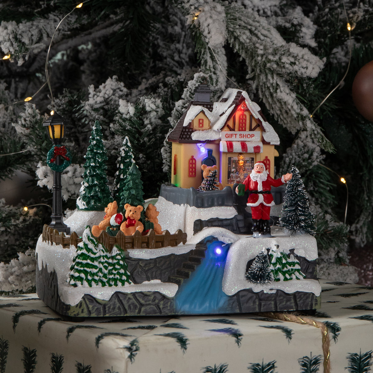 18cm Light up Christmas Gift Shop Snow Scene with Music and LEDs