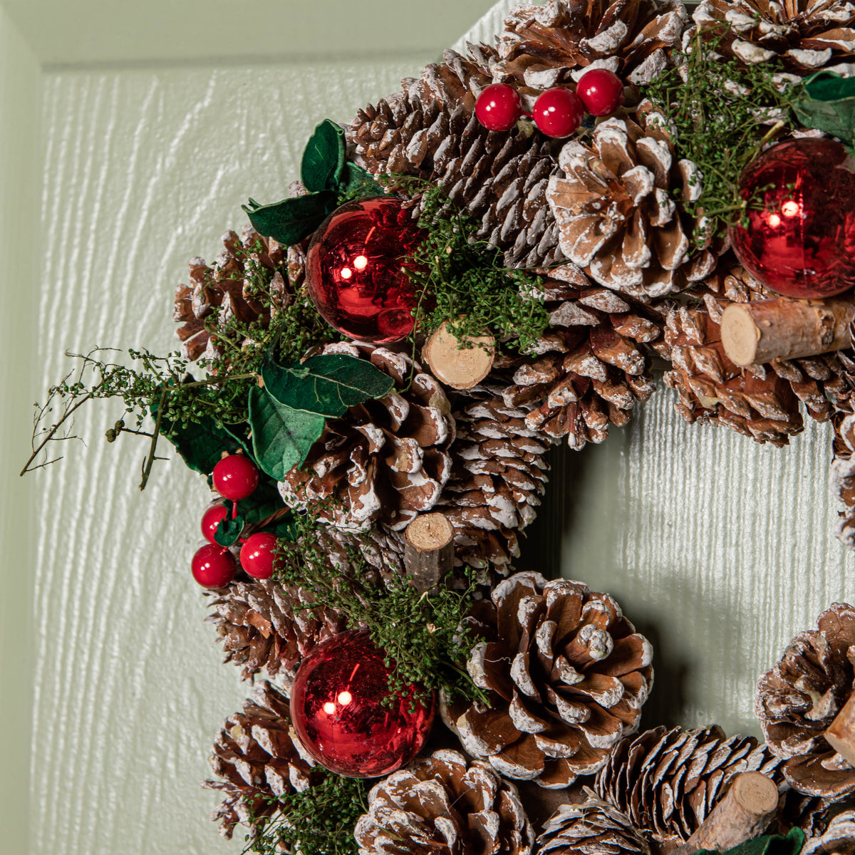 30cm Hanging Christmas YuleFest Wreath with Red Baubles & Snow Tipped Pine Cones