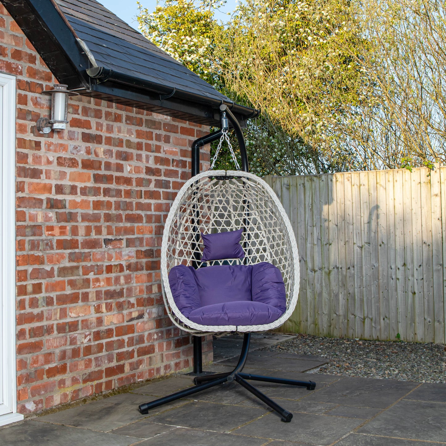 Samuel Alexander Hanging Garden Rattan Egg Chair with Steel Frame and Waterproof Cover in Indigo