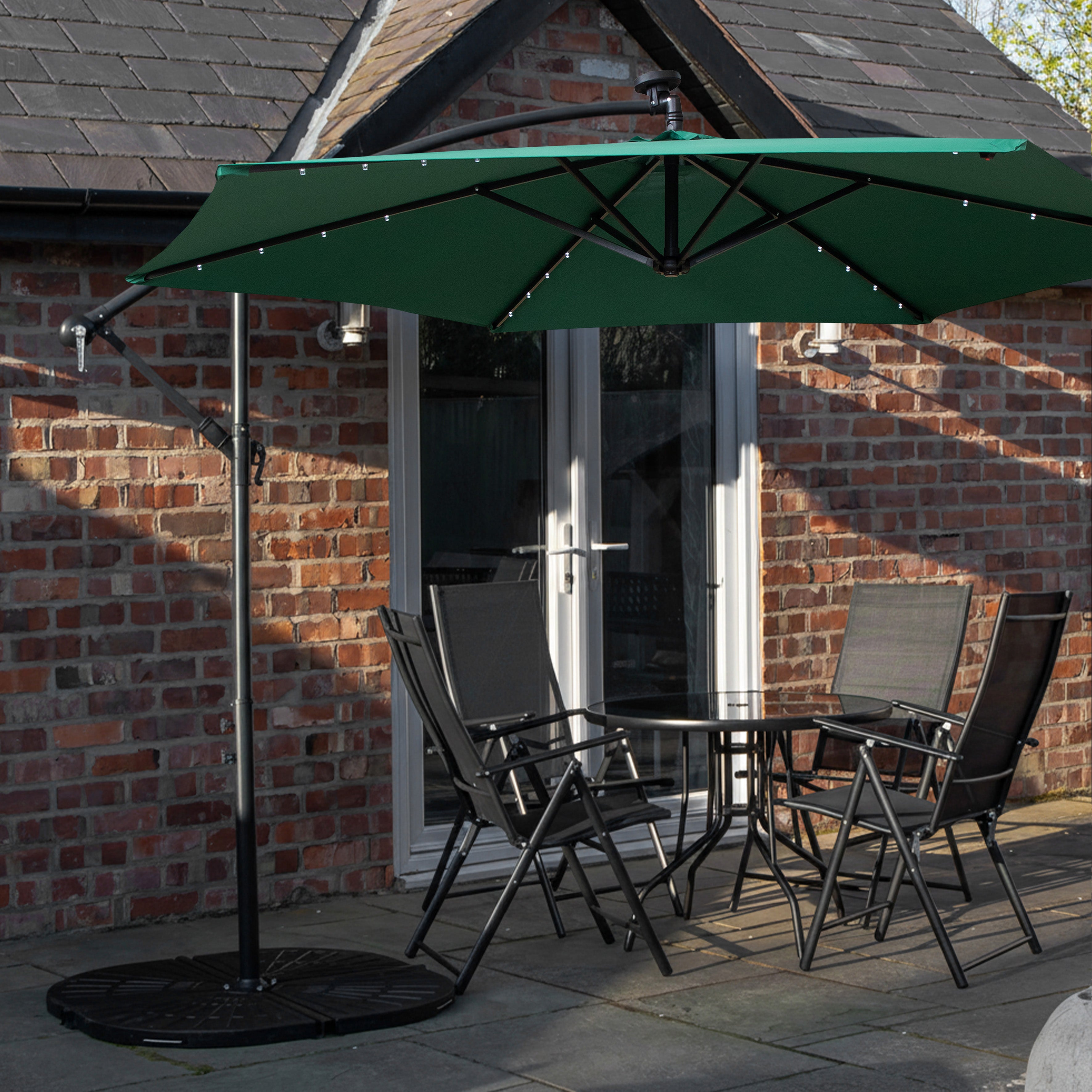Outdoor 4 Person Round Glass Top Garden Dining Table Chairs With Green Banana Lit Parasol and Base Set