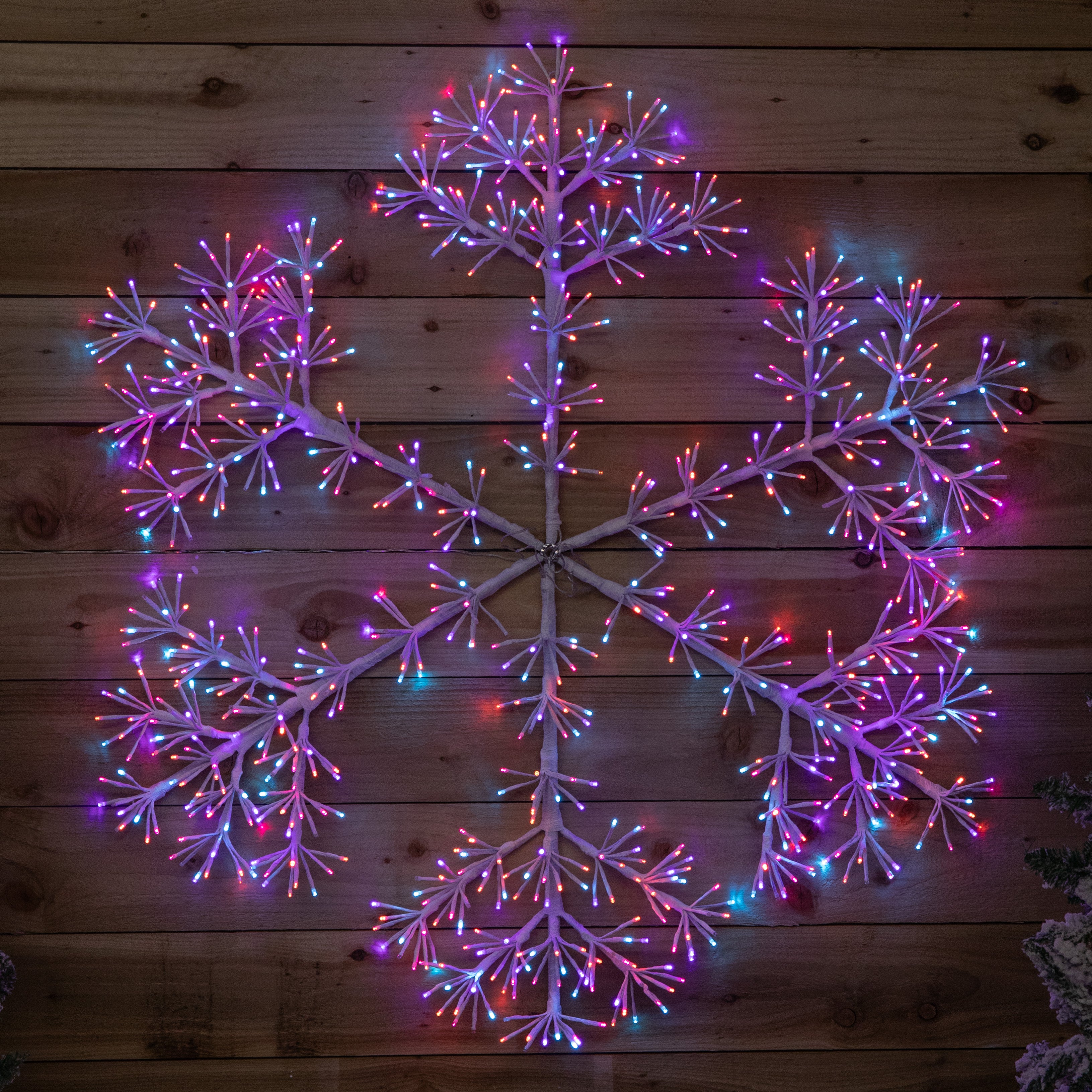 1.2m Twinkling Starburst Snowflake Christmas decoration with 960 Rainbow LEDs