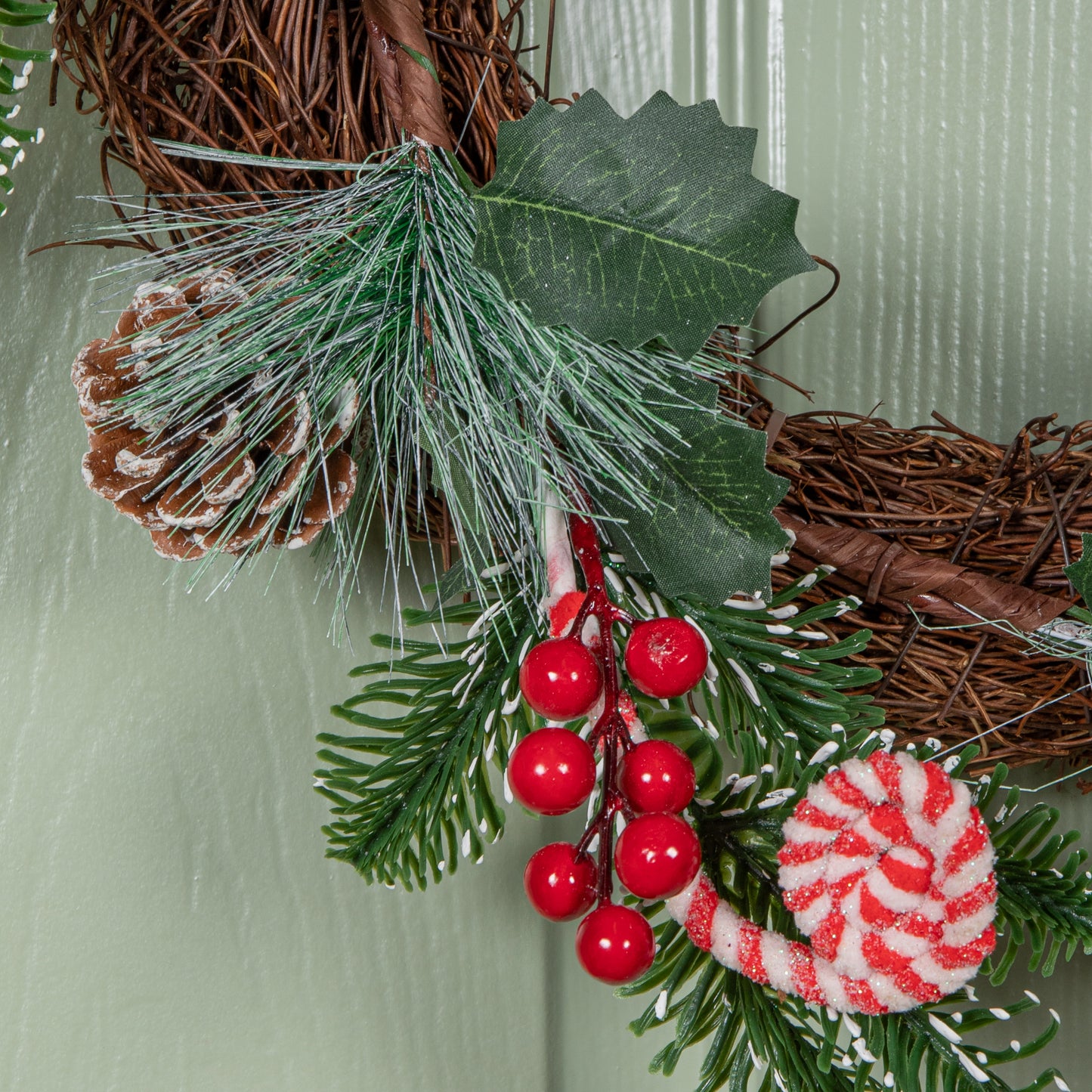 40cm Candy Swirls Christmas Wreath with Pinecones Red Berries and Candy Canes