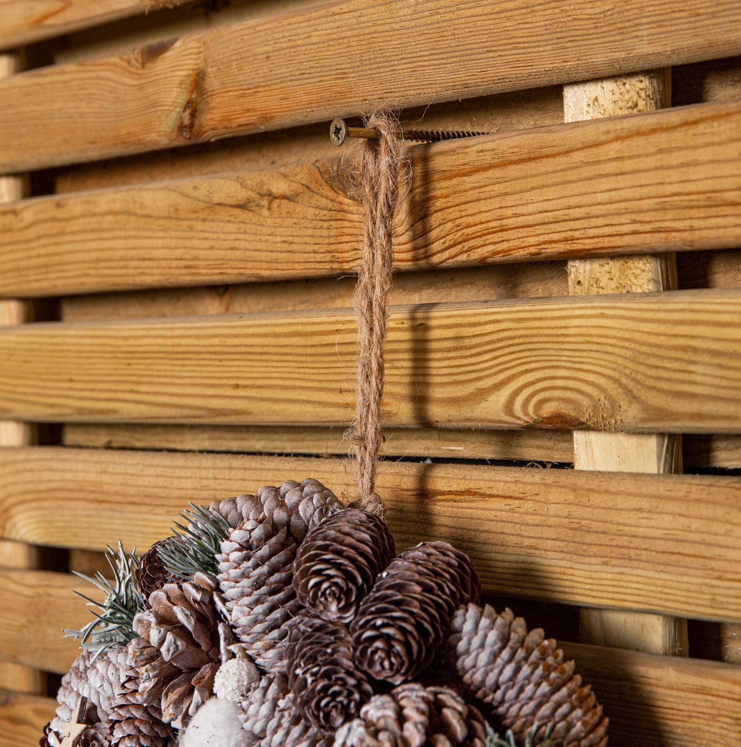 36cm Frosted Hanging Christmas Wreath with Pine Cones & Wooden Stars
