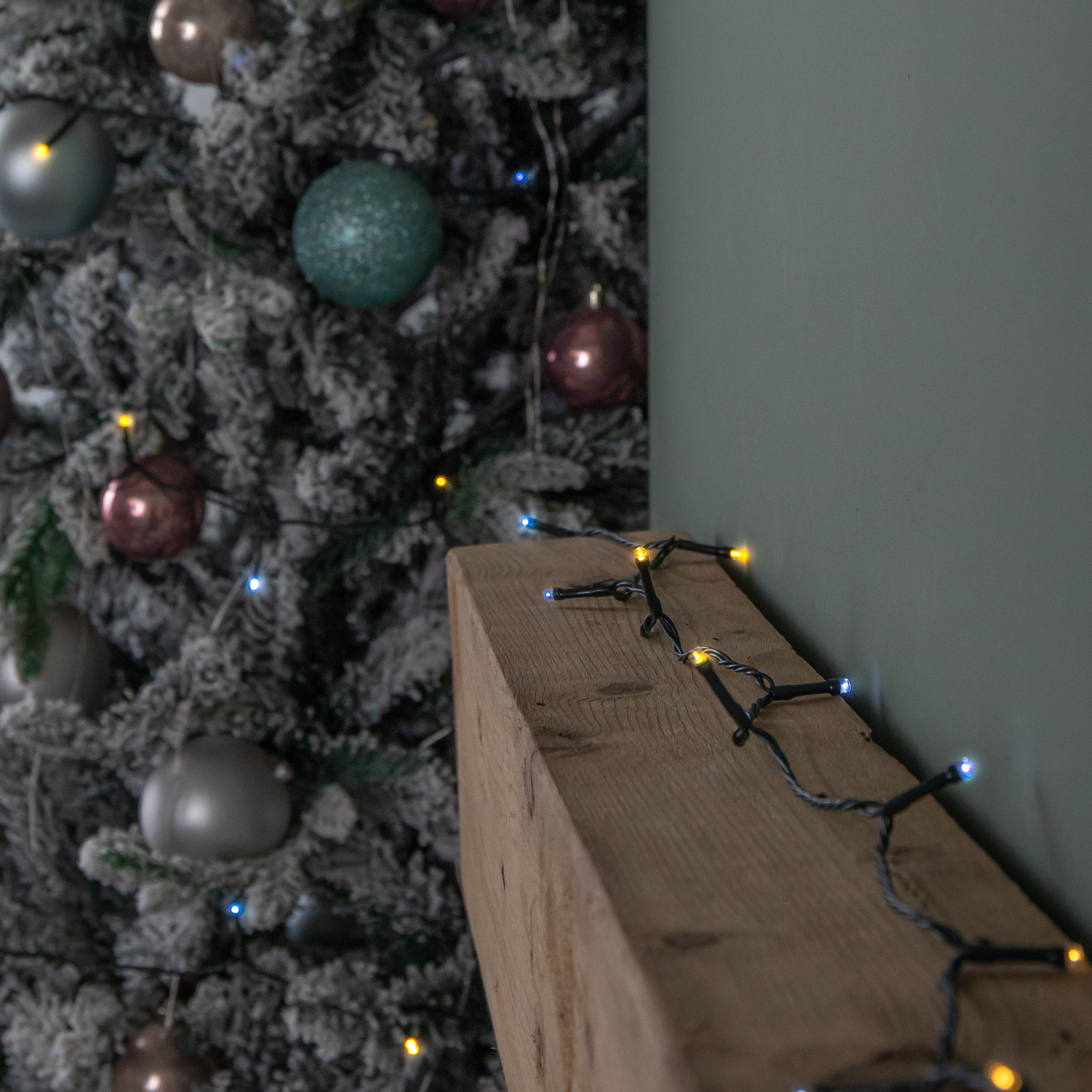 60m Battery Operated Multi-Action Christmas String Lights with 600 Cool & Warm White LEDs