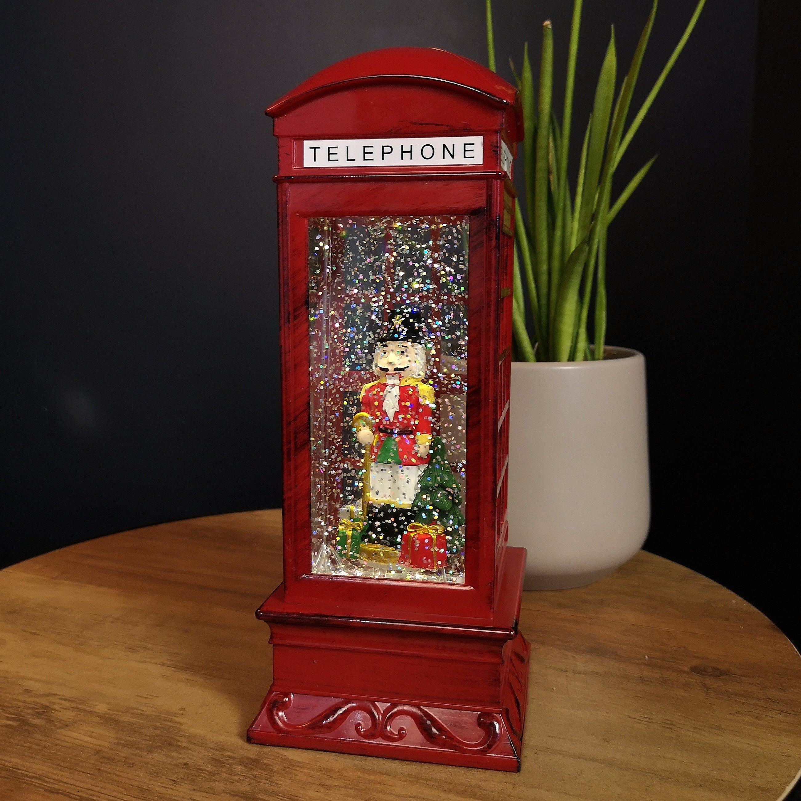 27cm LED Christmas Glitter Water Spinner Red Telephone Box with Nutcracker Scene
