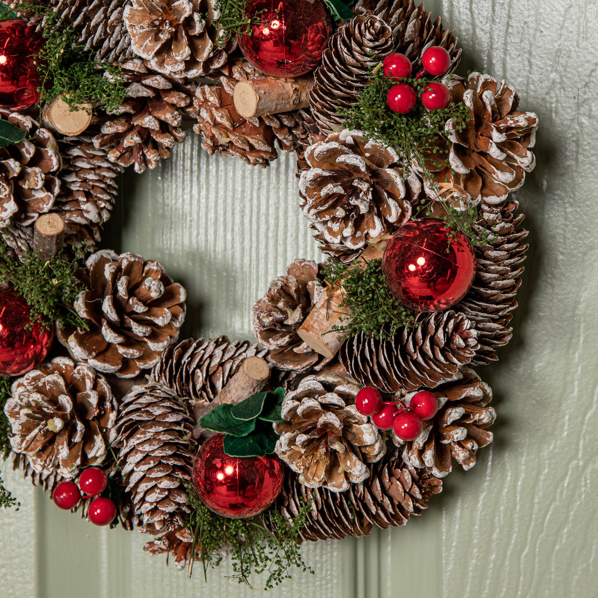 30cm Hanging Christmas YuleFest Wreath with Red Baubles & Snow Tipped Pine Cones