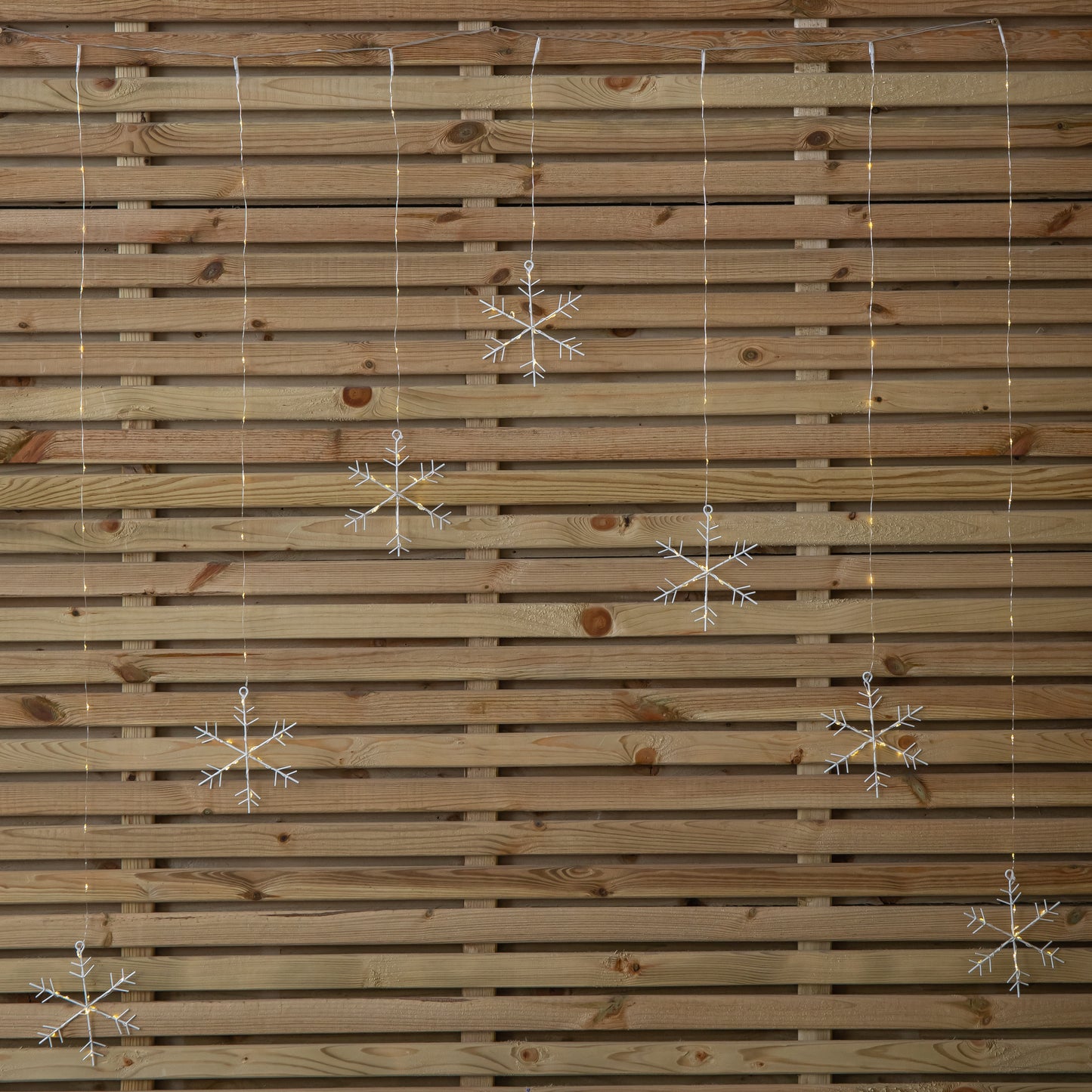 1.2m Battery Operated Snowflake Christmas Curtain Lights with 147 Warm White LEDs