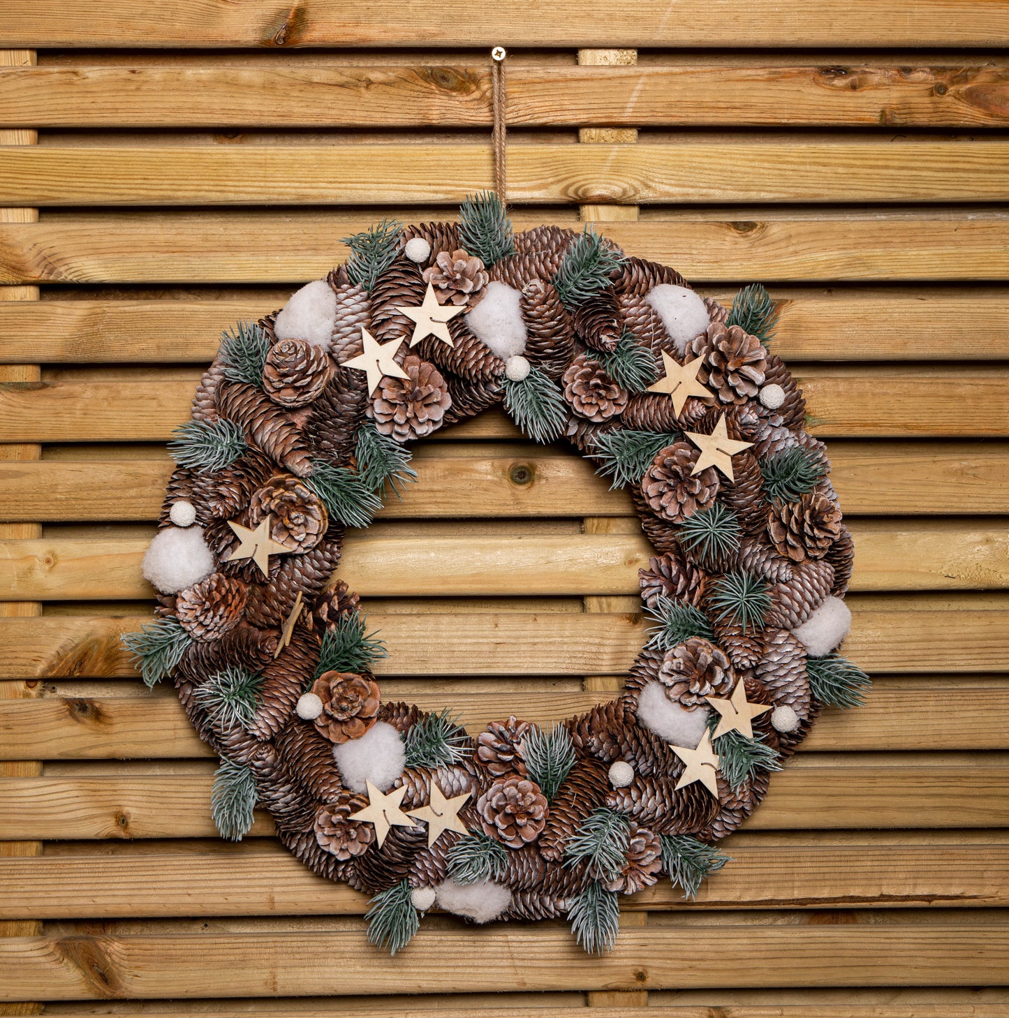 50cm Frosted Hanging Christmas Wreath with Pine Cones & Wooden Stars