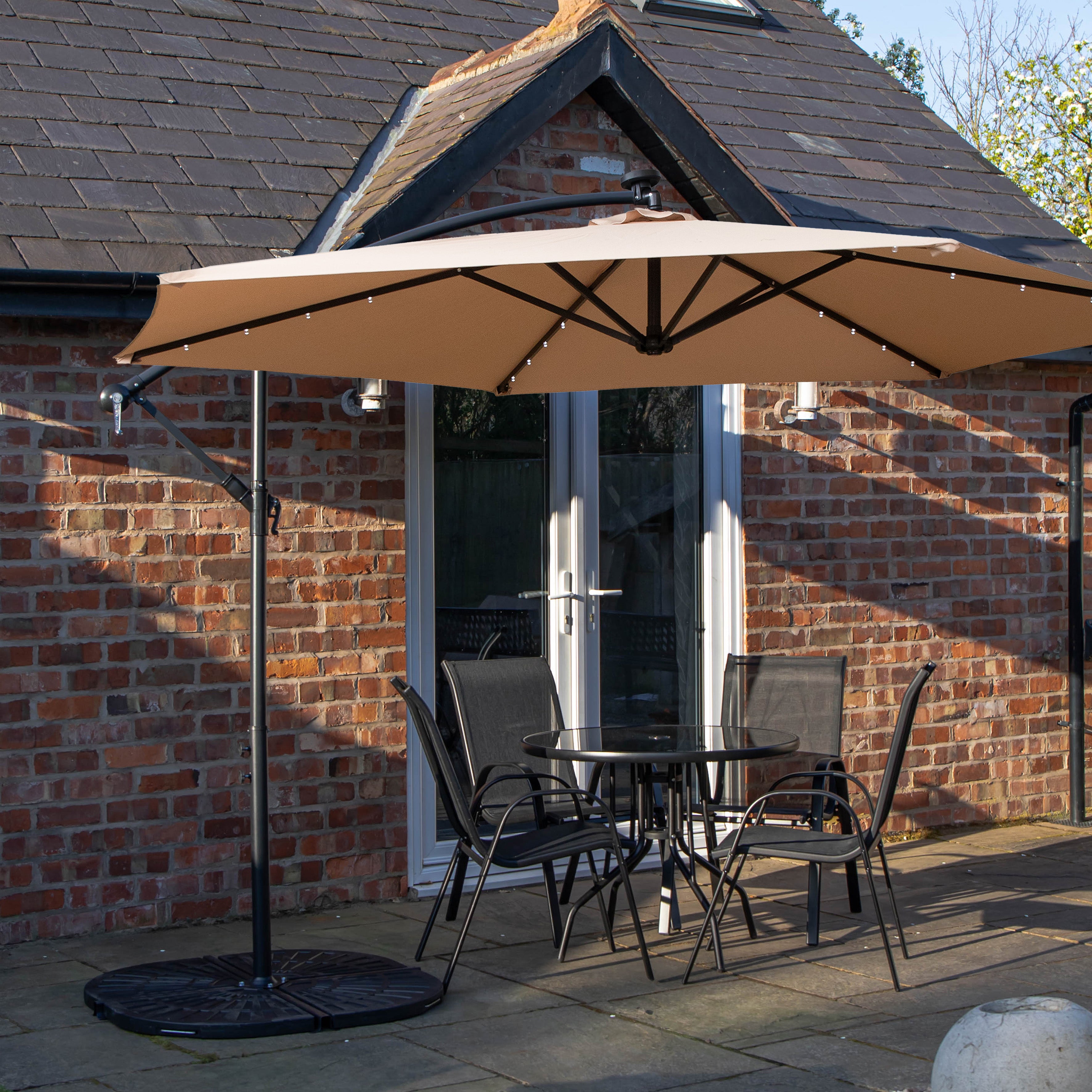 Outdoor 4 Person Round Glass Top Garden Dining Table Chairs With Beige Banana Lit Parasol and Base