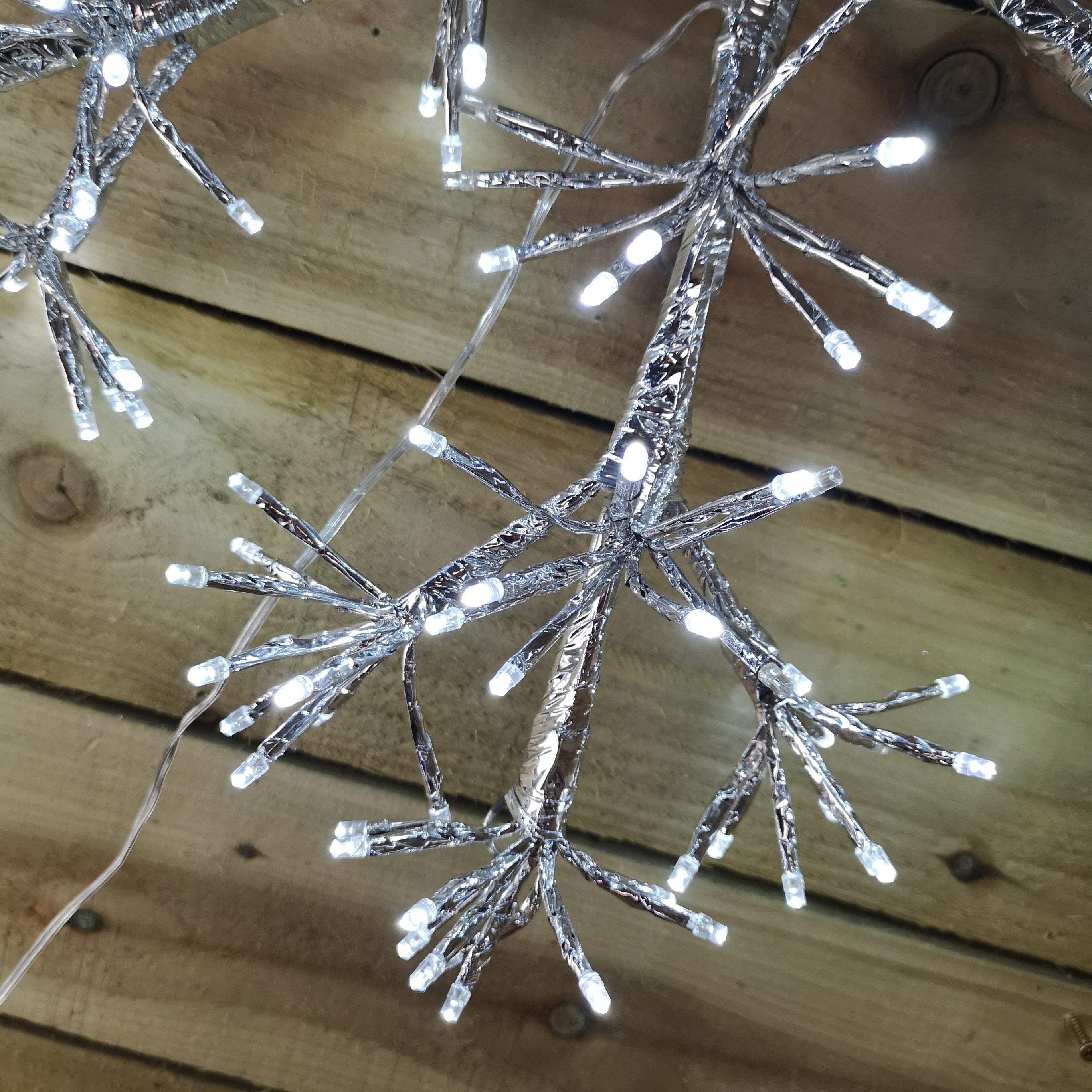 Premier 60cm Silver Starburst Snowflake Wall Window Decoration with 300 Warm White LEDs