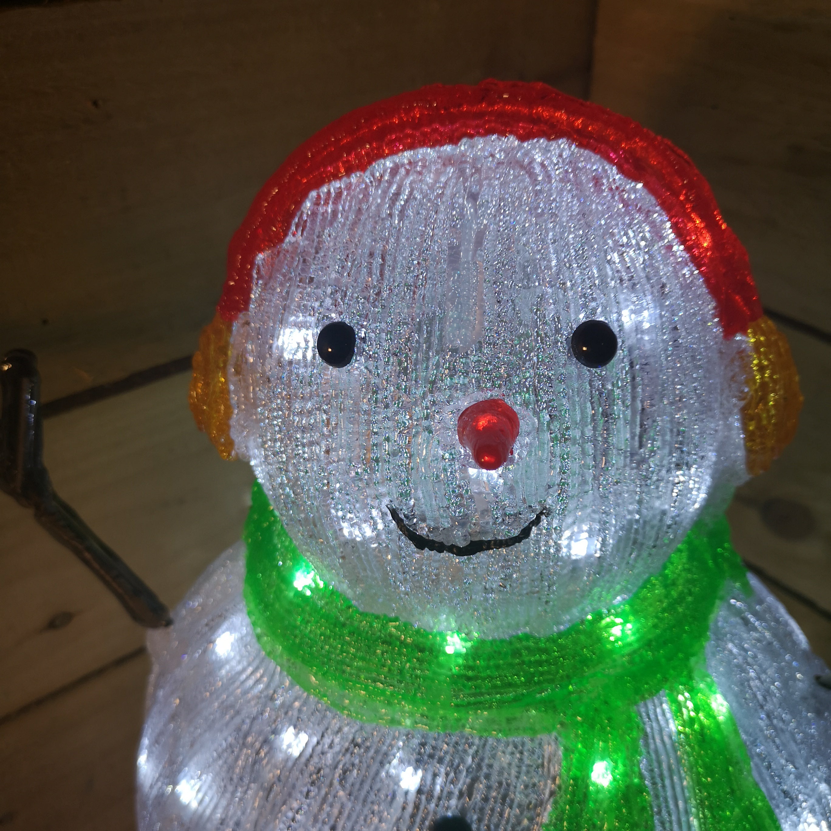 Lumineo 47cm Acrylic Christmas Snowman Green Scarf And Earmuffs Cool White LEDs
