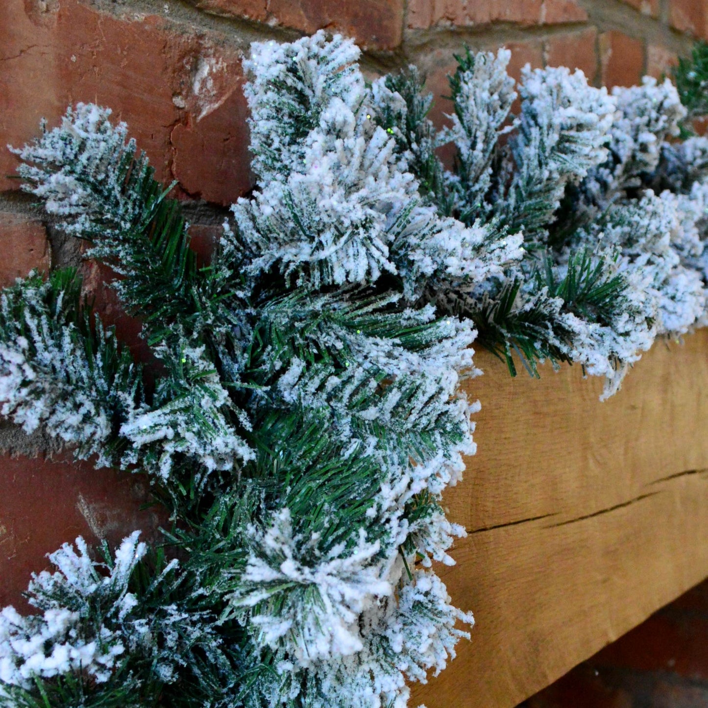 Premier 2.7m Snow Flocked Pine Christmas Garland with Glitter Finish