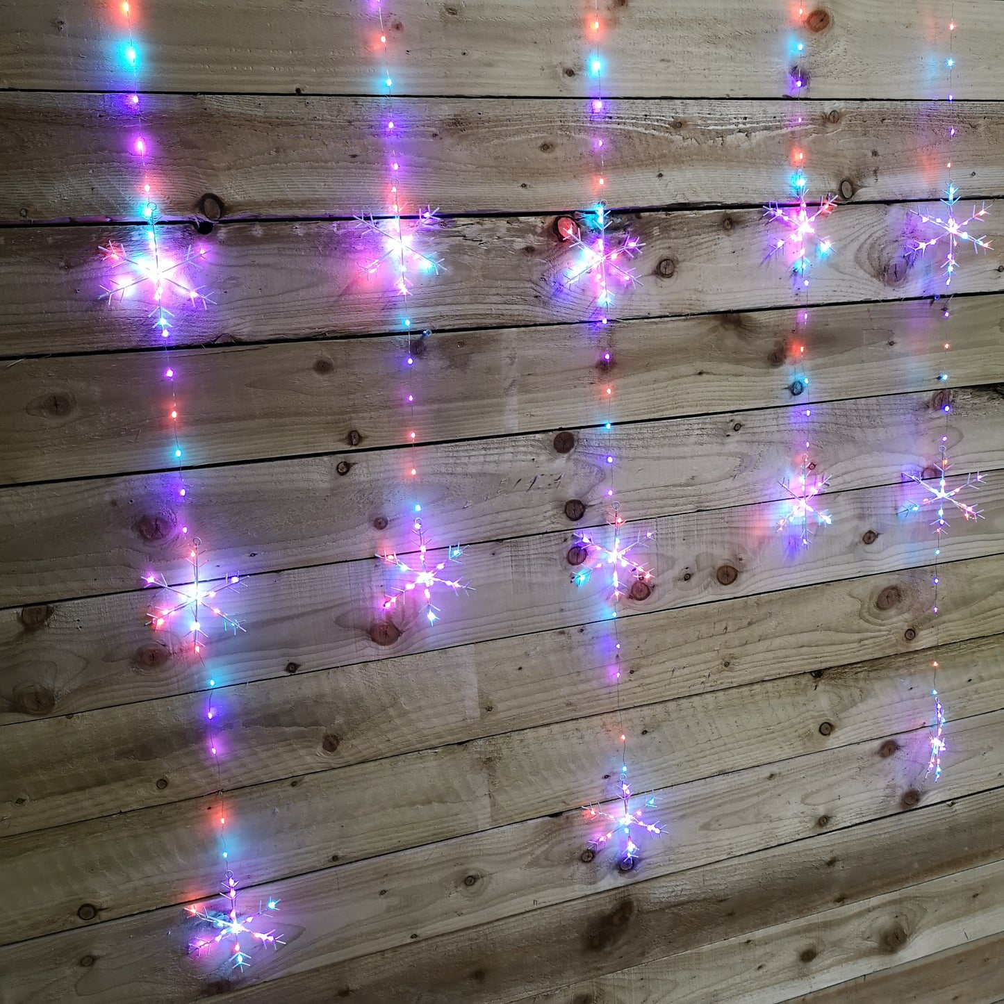 390 LED 1.3m x 1.2m Premier Christmas Snowflake Curtain Lights in Static Rainbow & Twinkling Orange