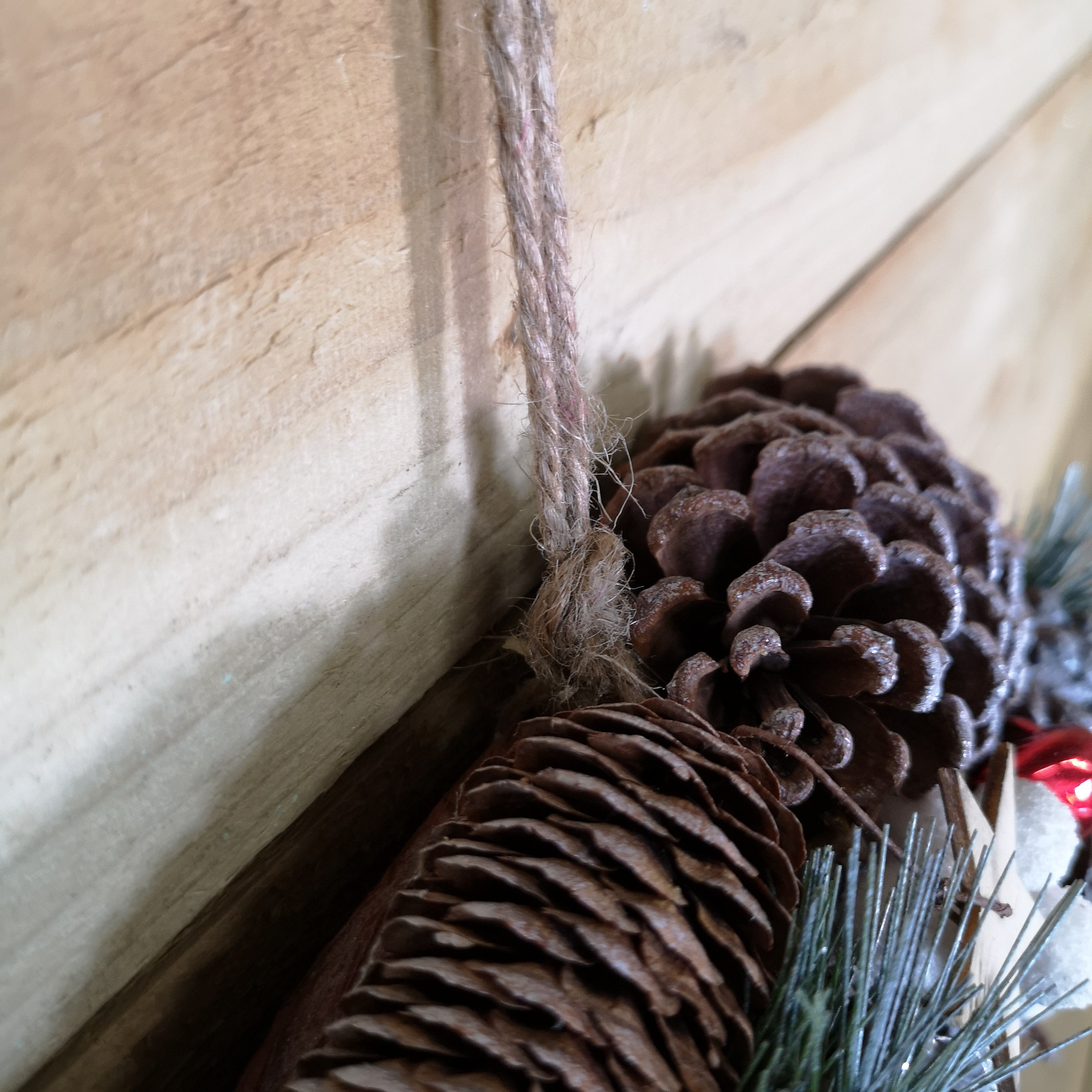 36cm Wooden Christmas White Berries Stars Bells and Grey Pine Cone Door Wreath